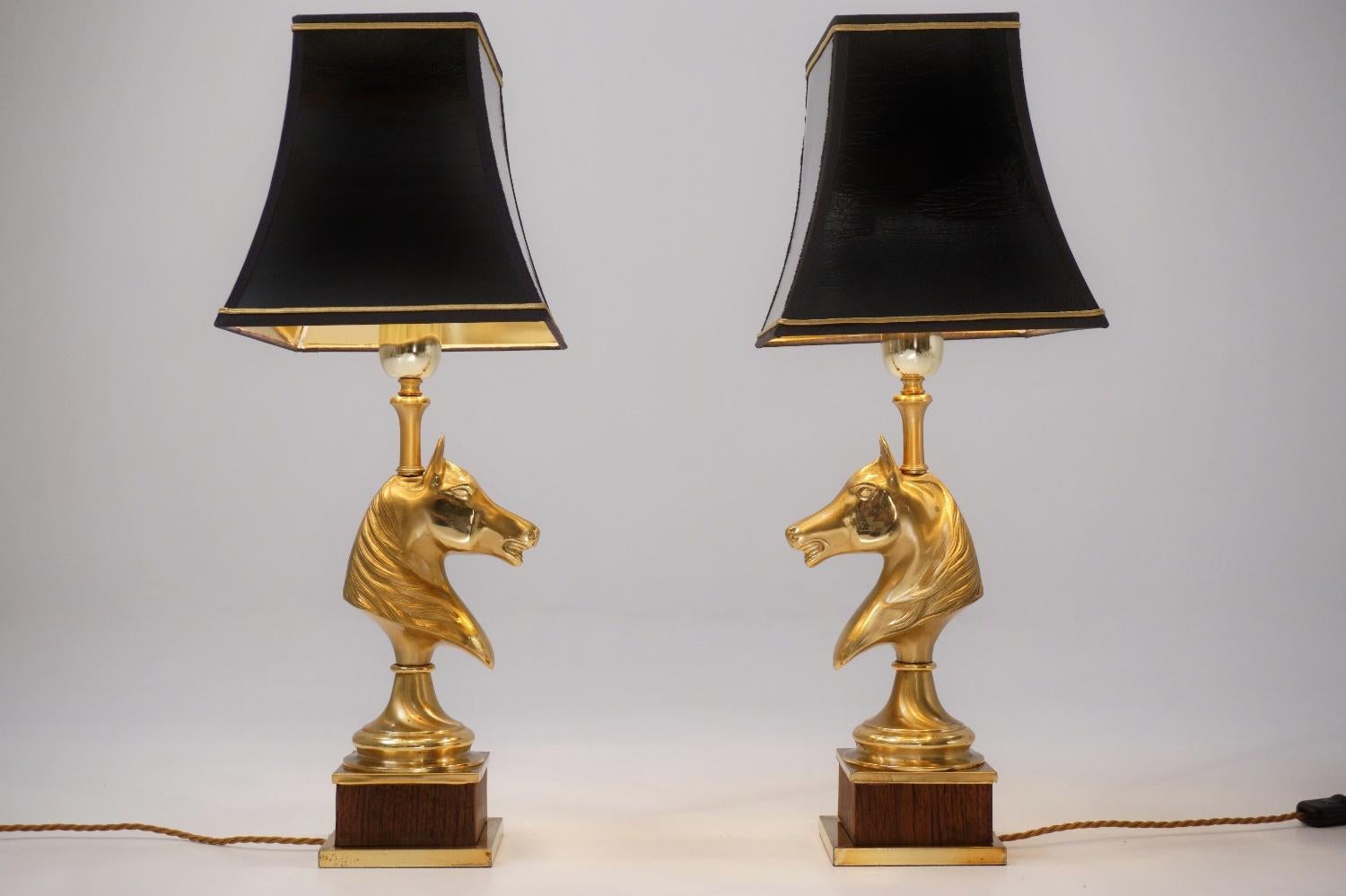 Maison Charles horse lamps, a pair in brass and wood, circa 1970s, French.

These table lamps have been gently cleaned while respecting the vintage patina. Both are newly rewired, earthed, fully working and PAT tested by an electrician. Each has a