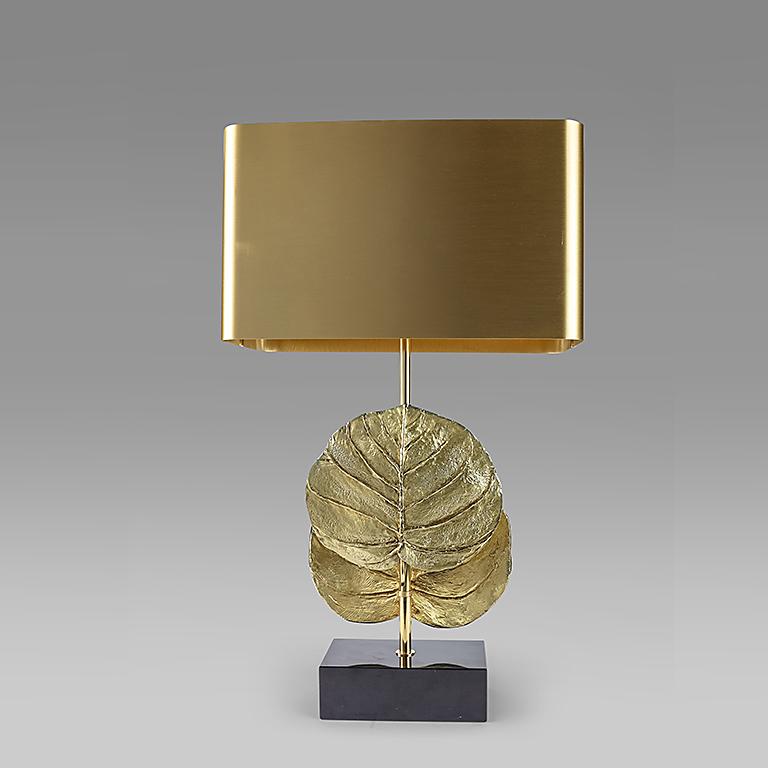 this Maison Charles table lamp Guadeloupe designed by Christiane Charles in 1970 is in bronze with its original shade. The lamp is documented in the Maison Charles catalogue. The lamp was American wired and professionally polished by an 