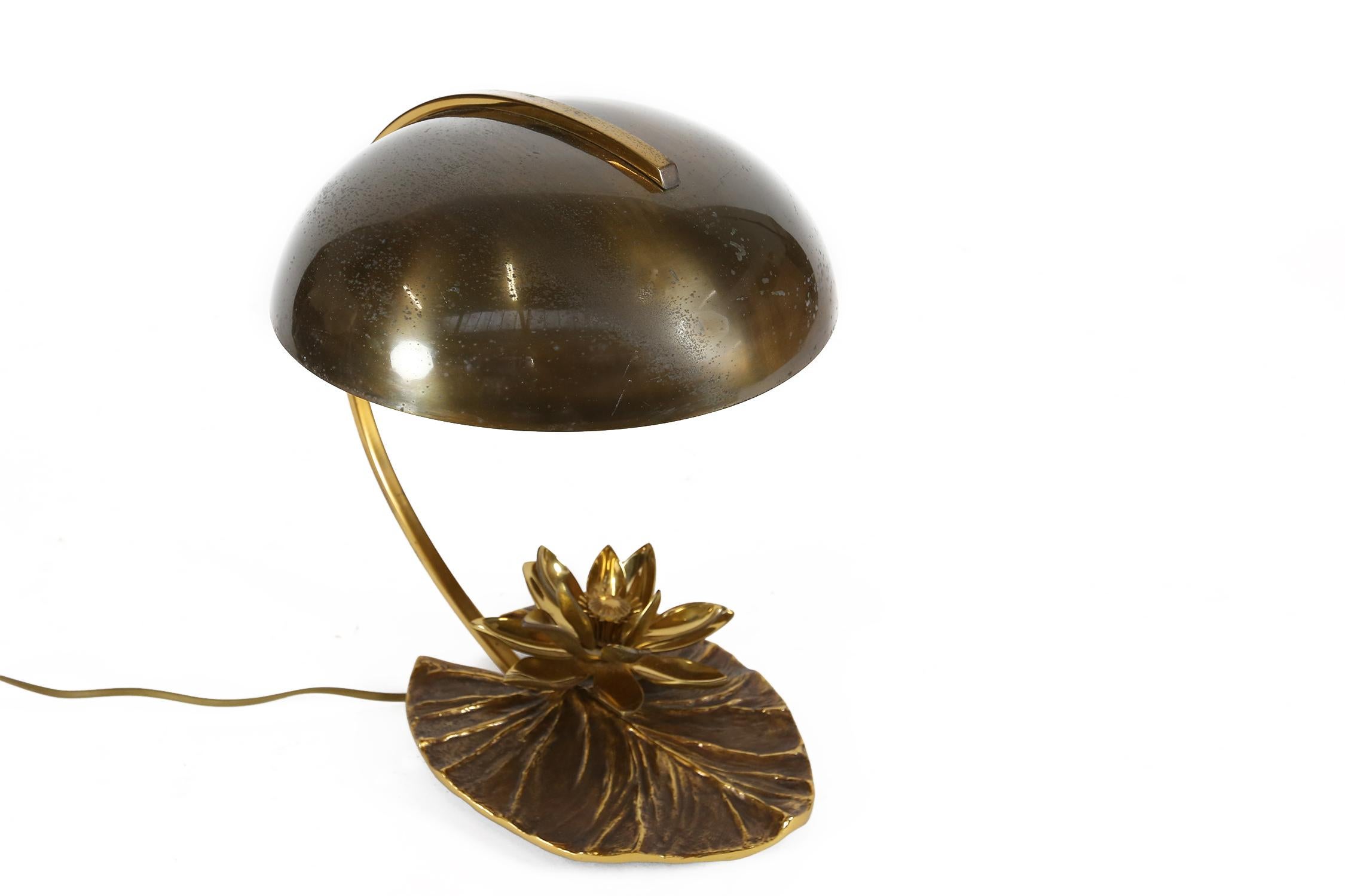 A Maison Charles “Nenuphar” bronze lamp designed and signed twice in the mould by Chrystiane Charles on the top and bottom of the lily pad leaf. 

Mounted with a bronze water lily flowers with original bronze shade with top arm. Also stamped on