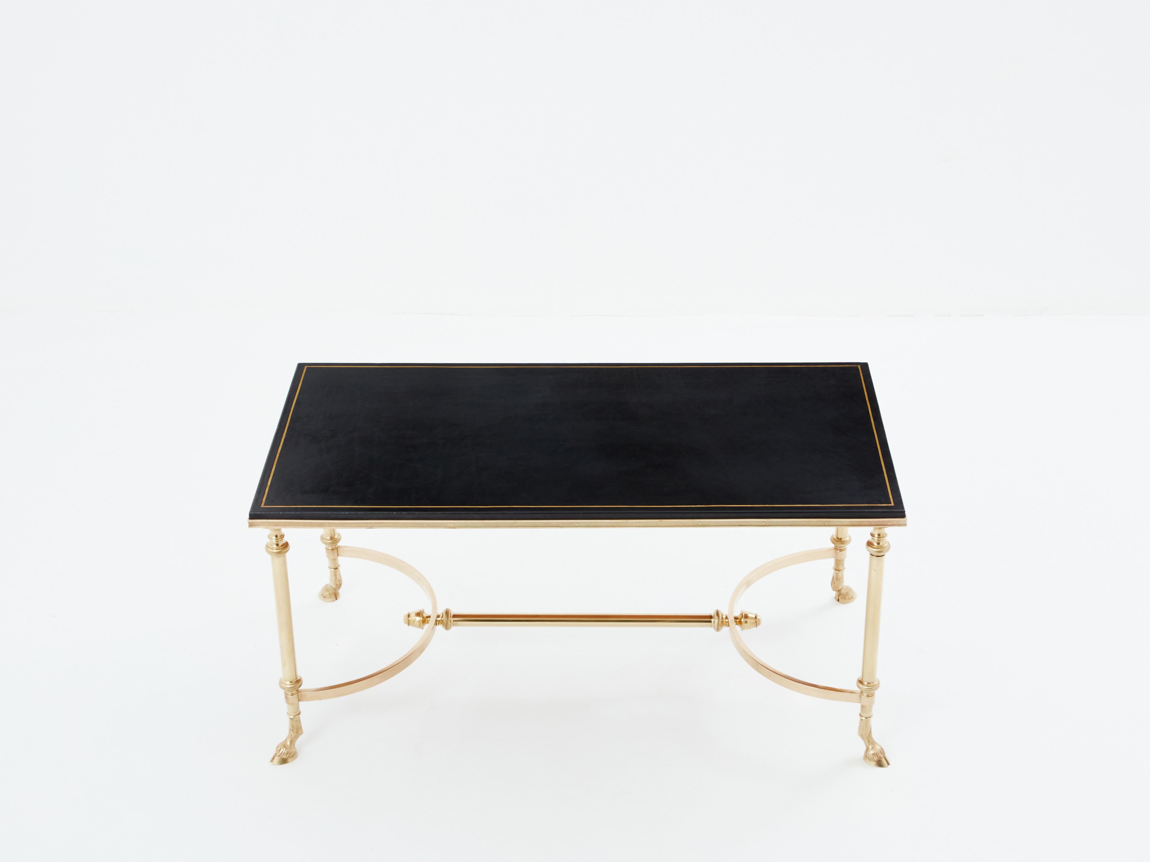 French Maison Charles neoclassical coffee table brass black leather 1970s For Sale