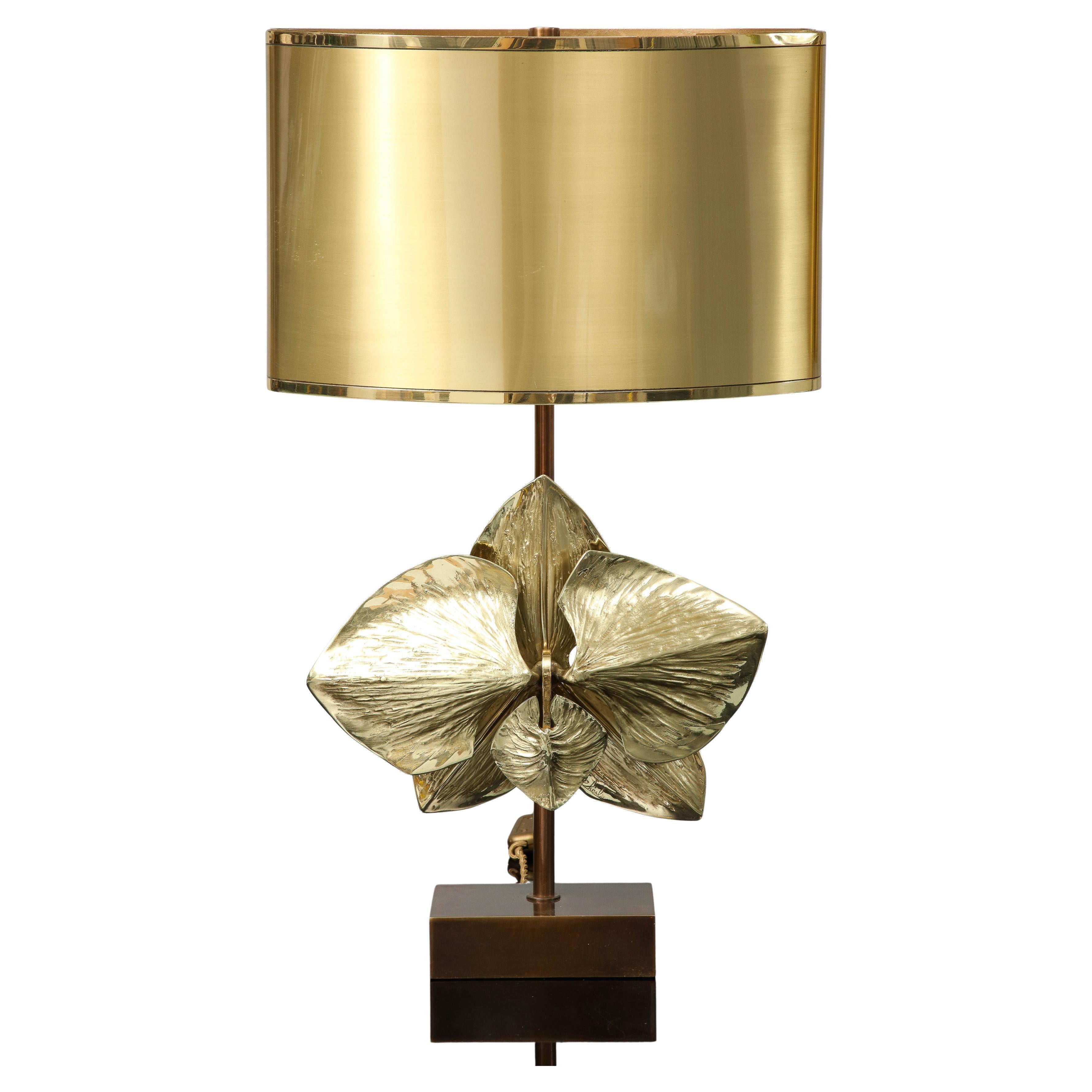 The Orchidee Lamp was made by Maison Charles in its atelier in Paris in the 70's. the lamp is referenced in the catalogue,  model 2155. It is signed and made in bronze. The shade is in brass with 2 tones of gold and the halves of the shade are