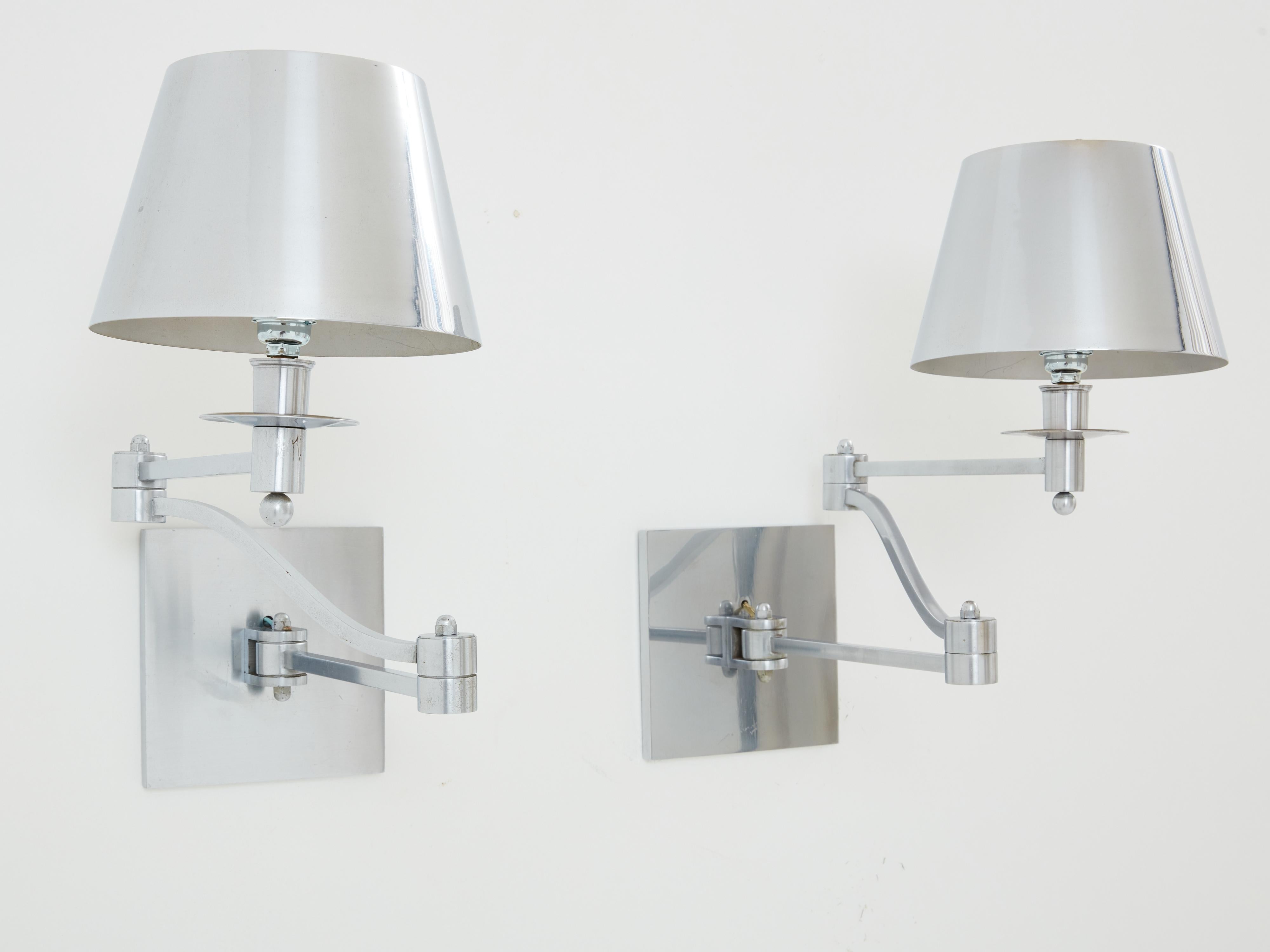 This pair of signed Maison Charles 1960s sconces is made from brushed steel. The sconces were designed by Christiane Charles, the infamous French design house, and they display the typical neoclassical loo, with wonderful attention to detail. These
