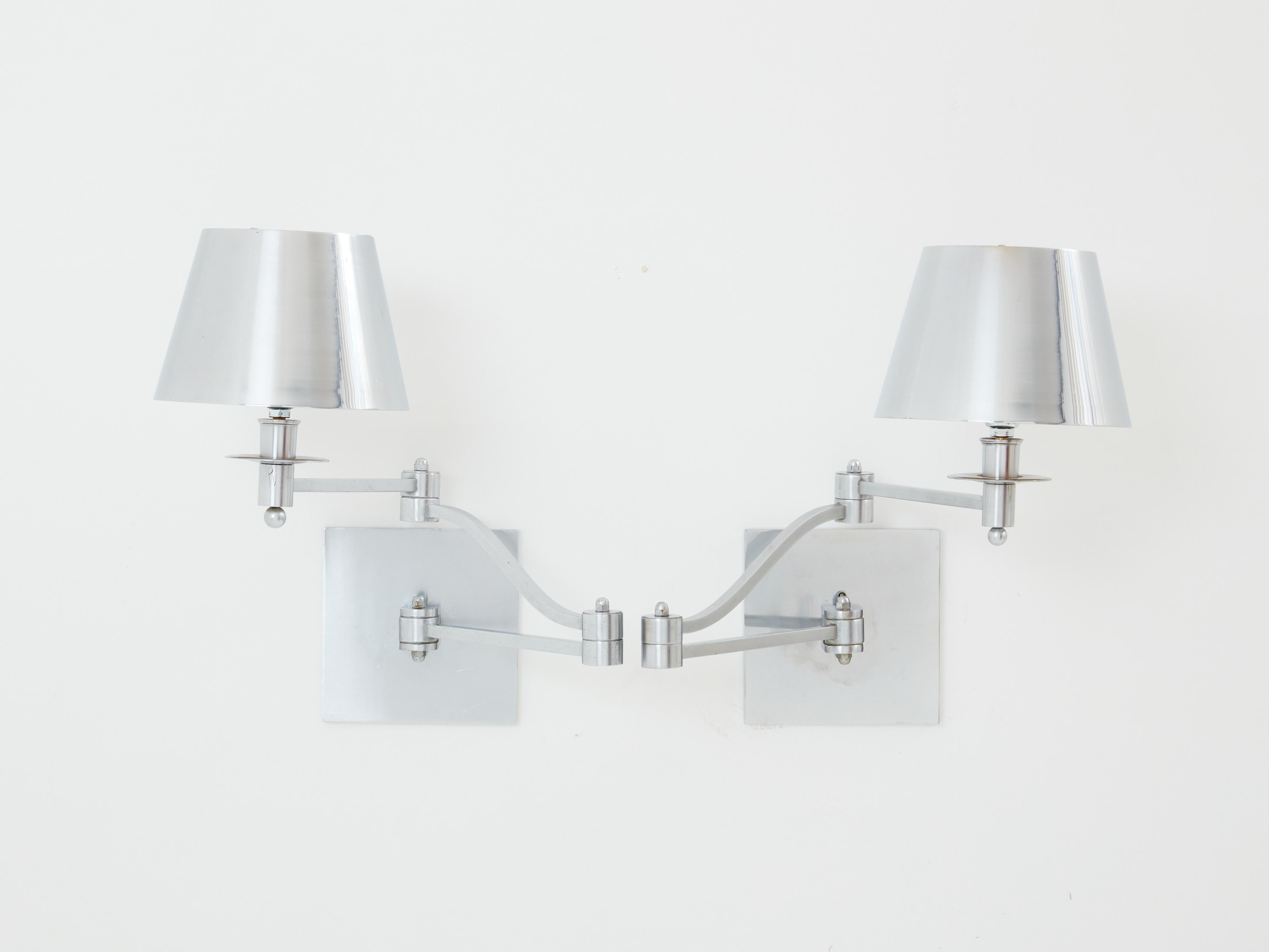 Mid-Century Modern Maison Charles pair of brushed steel adjustable swing-arm sconces 1960s For Sale