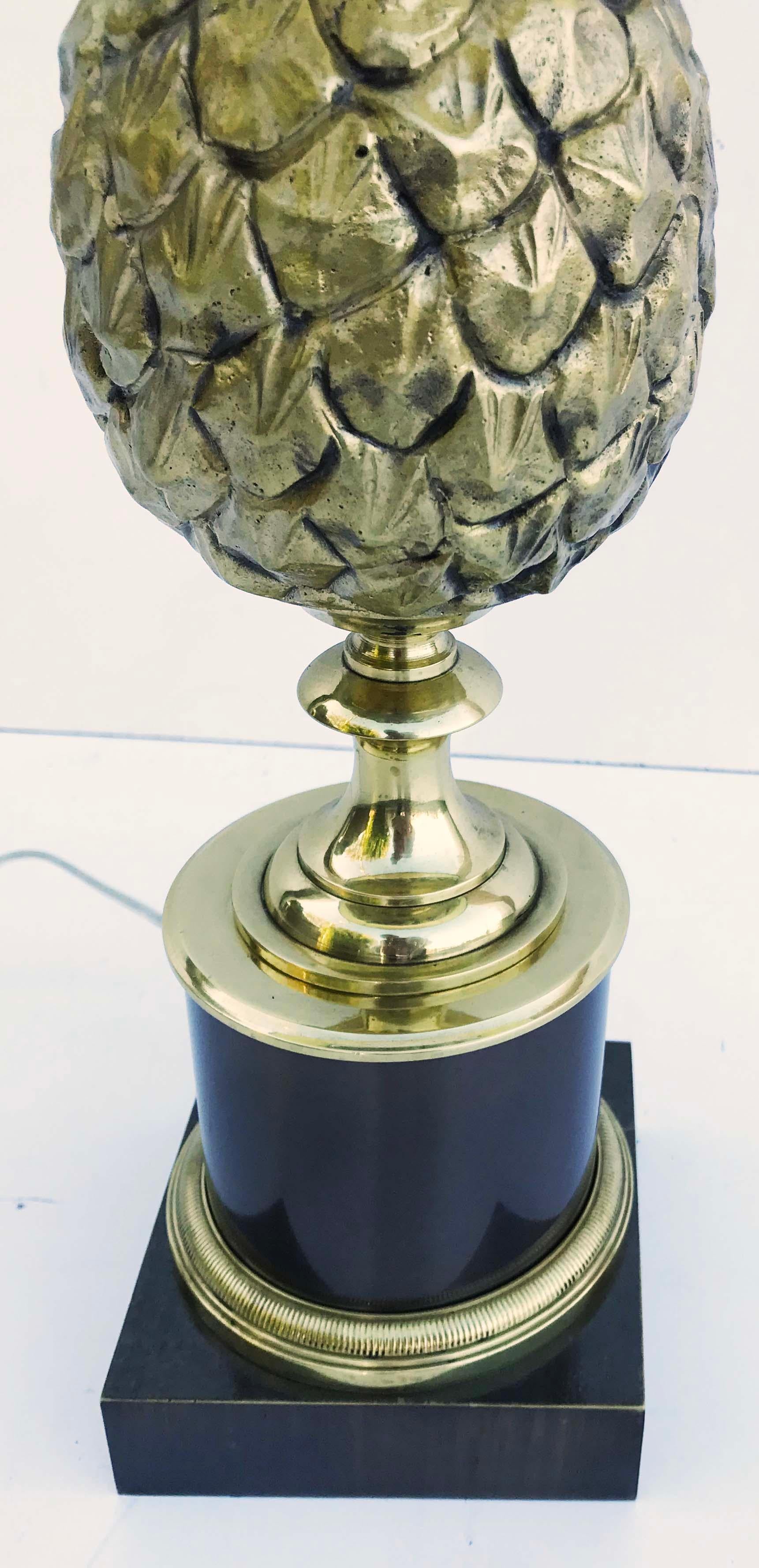 Superb bronze table lamp my the famous Maison Charles, pine cone model.
1 light, 100 max Bulb
US rewired and in working condition
Measures: Harp: 10