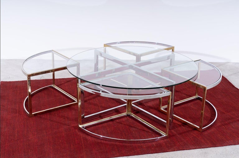 Extremely rare round Maison Charles coffee table with 4 side tables in chromed and gold plated steel. Very handy, because you can simply slide the four side tables under your table.

Maison Charles was originally founded in 1908 by Ernest Charles