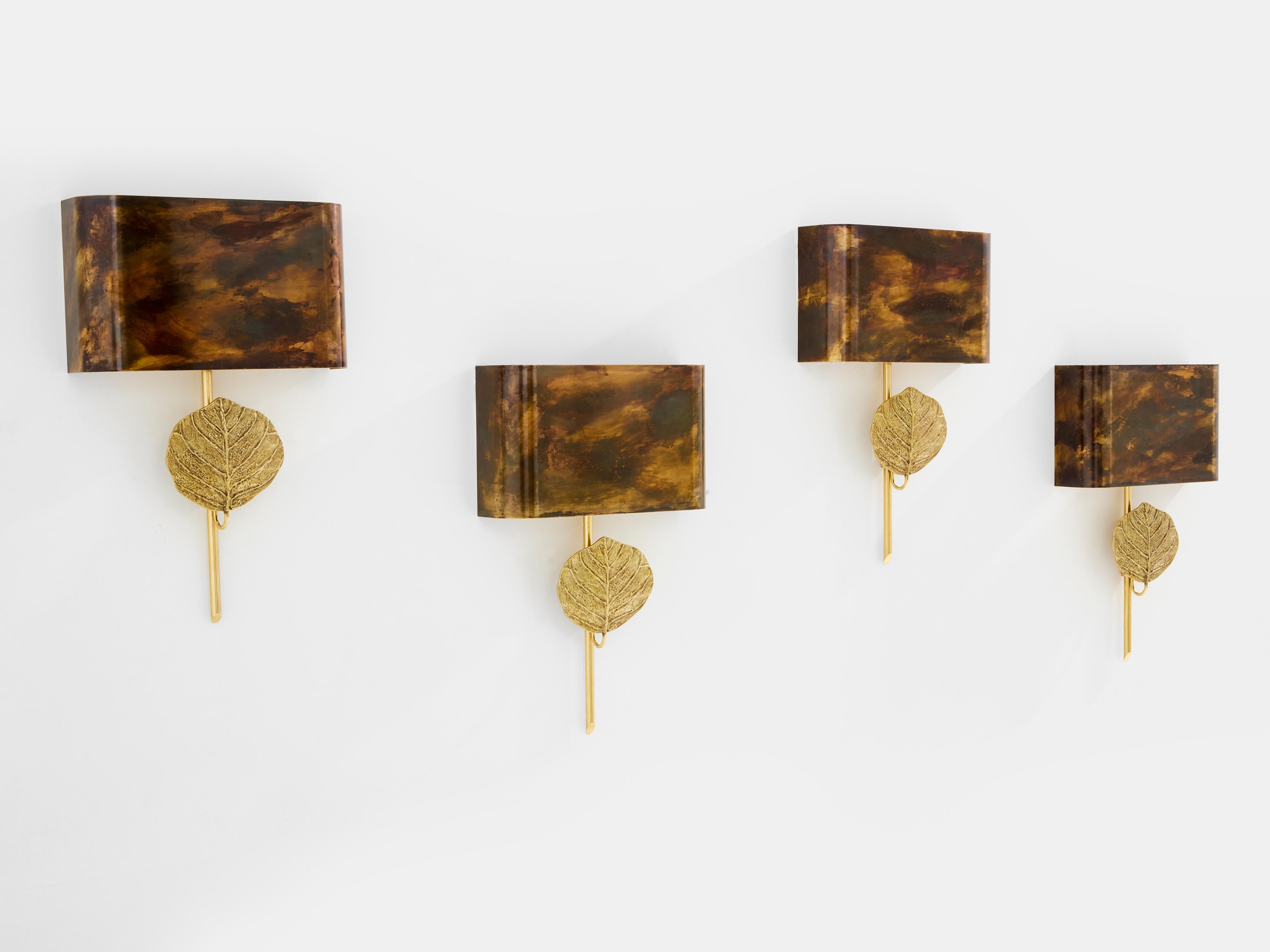 Maison Charles lighting pieces always infuse French timeless elegance, and this rare set of four wall lights, edited in the 1970s, is a perfect example. This model is called Clea and was designed by Chrystiane Charles. Each sconce features a solid