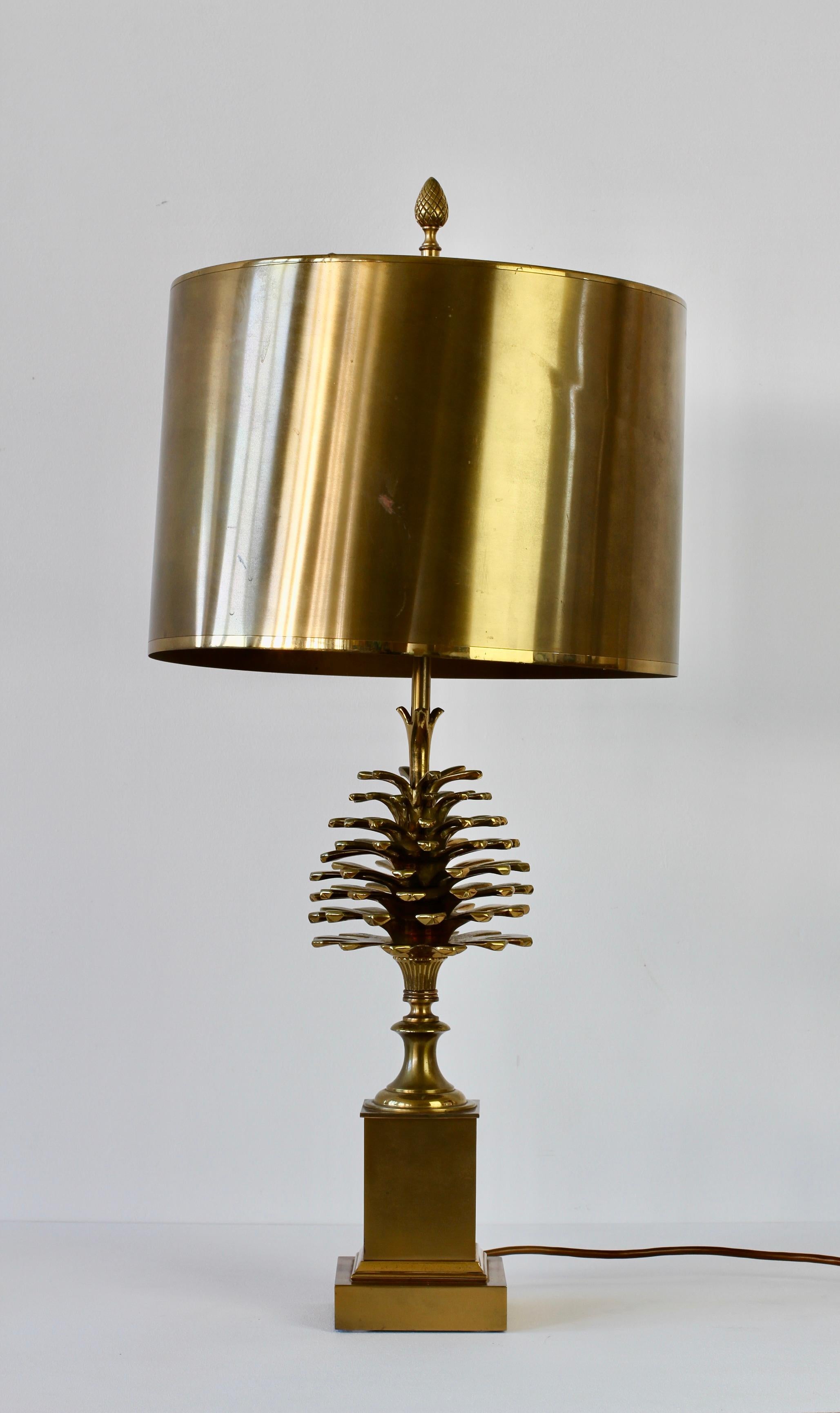 Maison Charles signed large patinated cast brass table lamp with original brass metal shade. Opulent, ornate and decadent, everything you would expect from beautifully crafted French design. Perfect for any Hollywood Regency home or lover of
