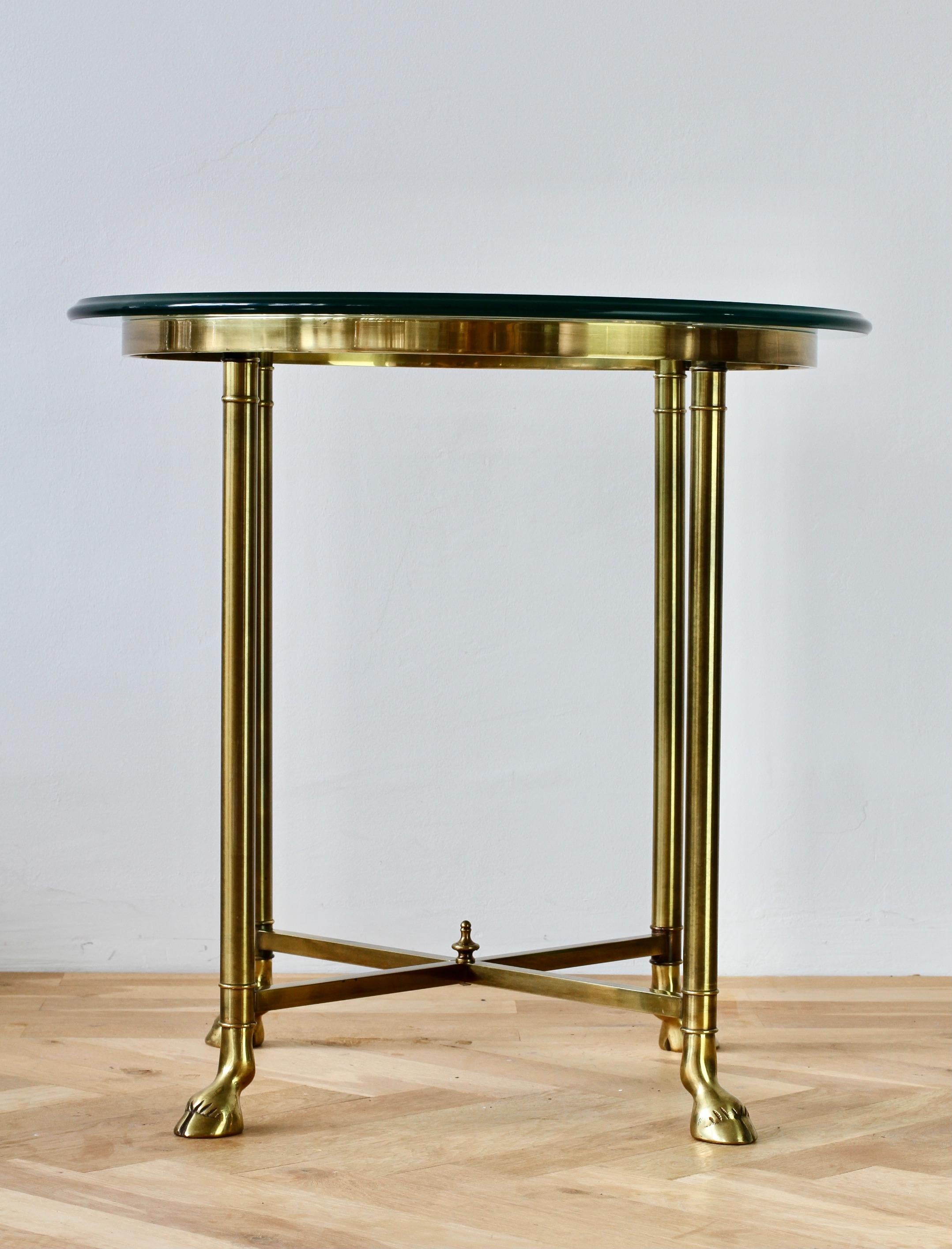 American vintage side table by La Barge in the style of French designers Maison Jansen and Maison Charles with a thick glass top in the circa 1975. Made of brass with elements cast in brass - the hoofed feet give the table an organic but also