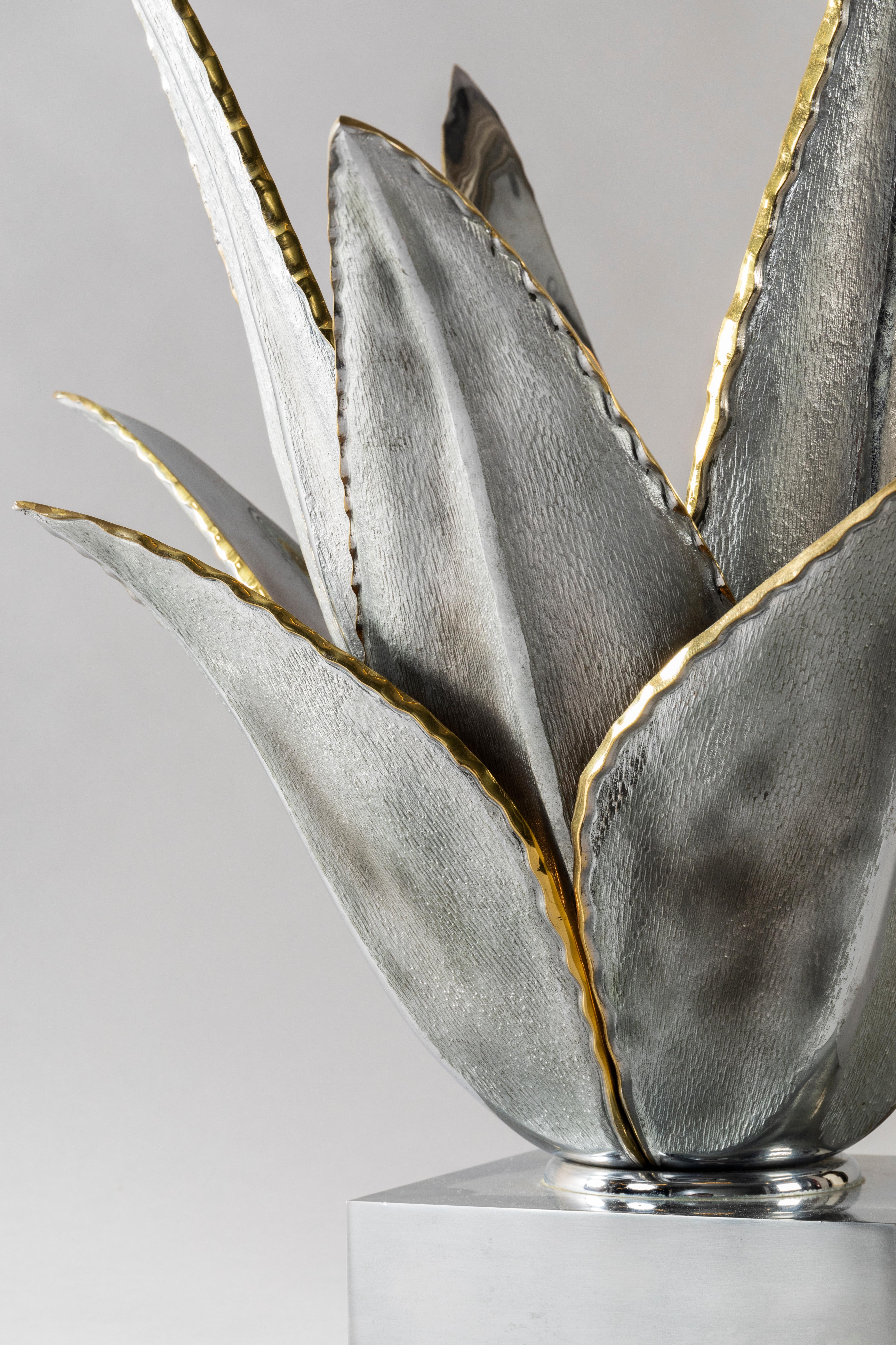 This elegant organic Aloes lamp has been made by Maison Charles in 1970.(Oldest France manufacturer in bronze casting).This flower has been designed by Jacques Charles who loves sophistication and botanical inspiration. Beautifull silver patina