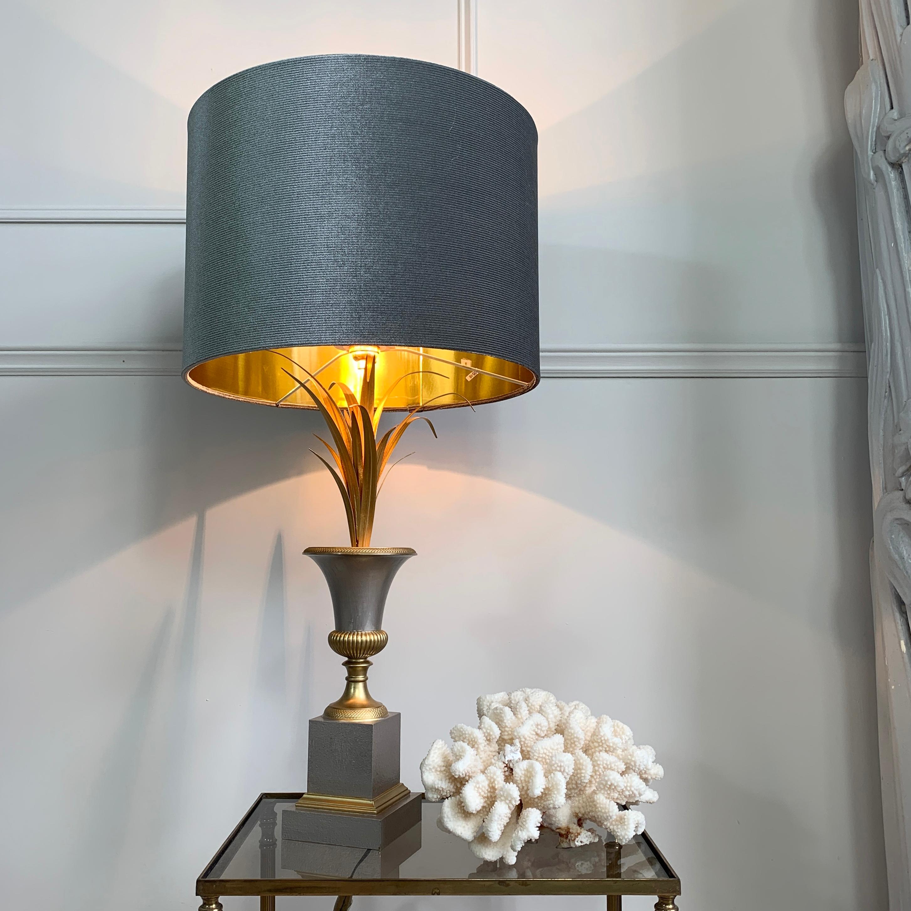 An exceptional vase roseaux table lamp from the world renowned Maison Charles. This piece is in a beautiful silver and gilt palette, fully stamped to the base Made in France / Charles et Fils.

Measurements: inc shade height 70cm x width 36cm, exc