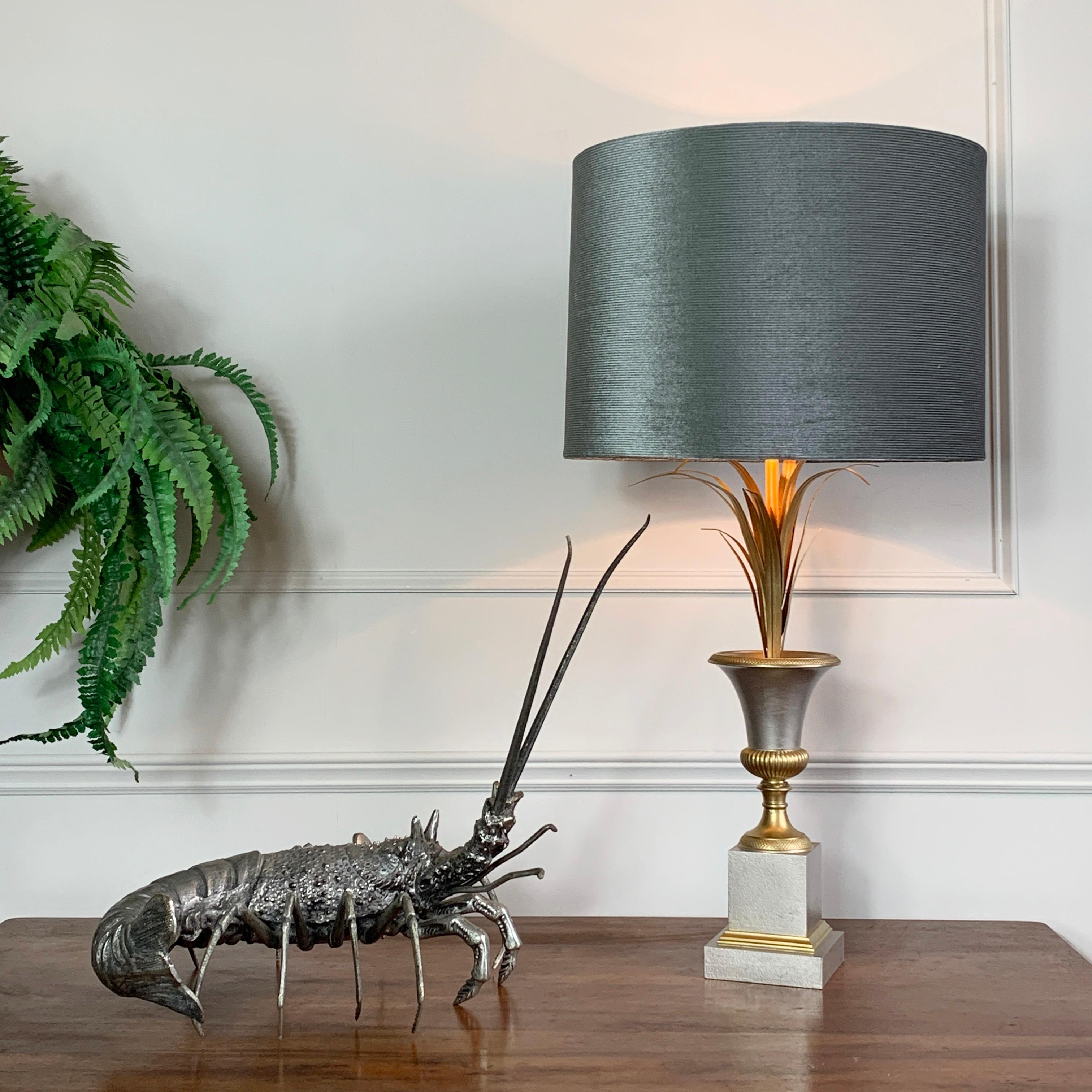 An exceptional vase Roseaux table Lamp from the world renowned Maison Charles. This piece is in a beautiful silver and gilt palette, fully stamped to the base Made in France / Charles et Fils.
The lampshade is a modern replacement, not original to