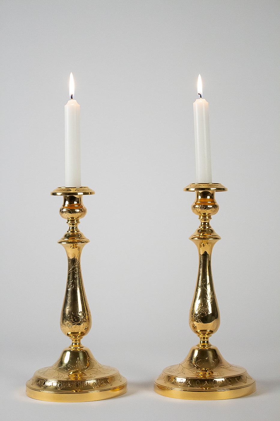Maison Christofle, late 19th century pair of silvered and gilted metal candlesticks.

An elegant pair silvered and gilded metal candlesticks, finely chiseled of flowers and branching.
Lovely French work by Maison Christofle, late-19th century,