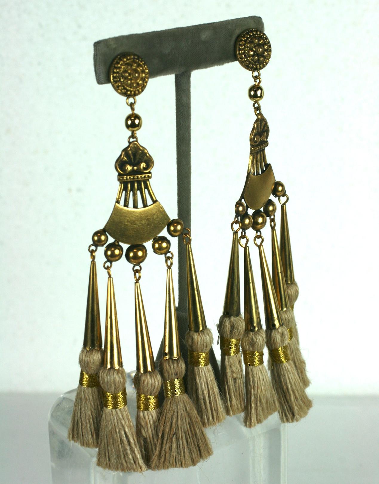 Important Maison Denez for Yves Saint Laurent Haute Couture African Collection Long Ear clips circa 1967. Of antique gilt bronze with jute tassel accents wrapped with gold bullion threads. Clip back fittings. 5.75