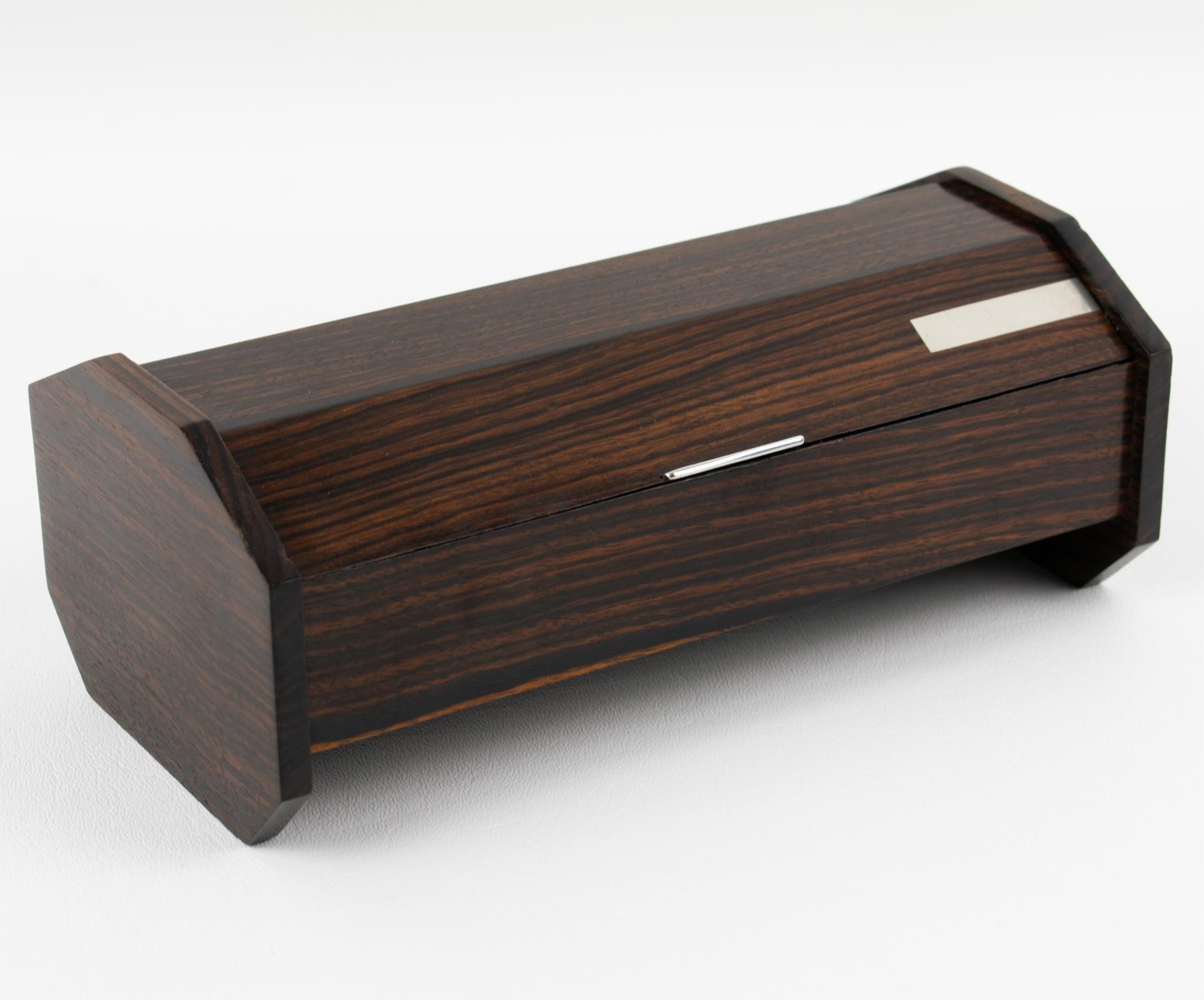 This exquisite French Art Deco decorative box is reminiscent of Desny's work. It features Macassar wood hexagonal sides with chromed metal accents on the lid—French Art Deco decoration at its finest, with excellent quality and a streamlined design.