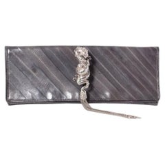 Maison Du Posh, knuckle ring clutch with dragon.