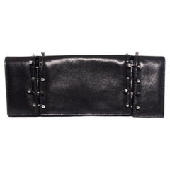 Maison Du Posh, Piercing skull clutch in black