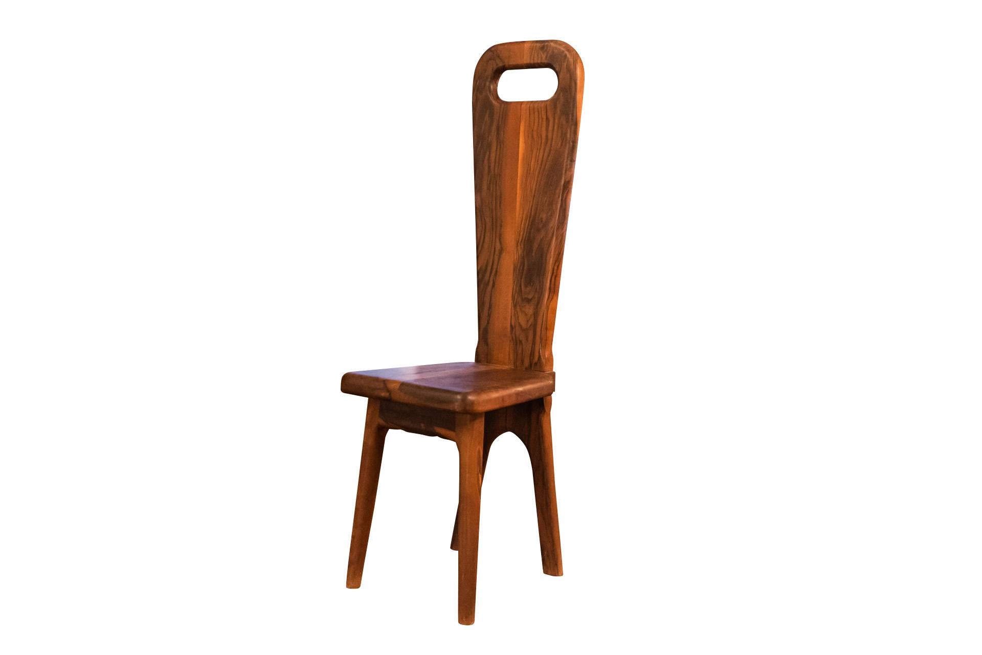 Maison Dubosq, Pairs of chairs in olive wood,
High rectangular backrest with openwork grip on the upper part,
Quadripod base,
circa 1970, Tourettes-sur-loup, France.

Measures : Height 109 cm, Width 33 cm, Depth 34 cm. 

Maison Dubosq is a