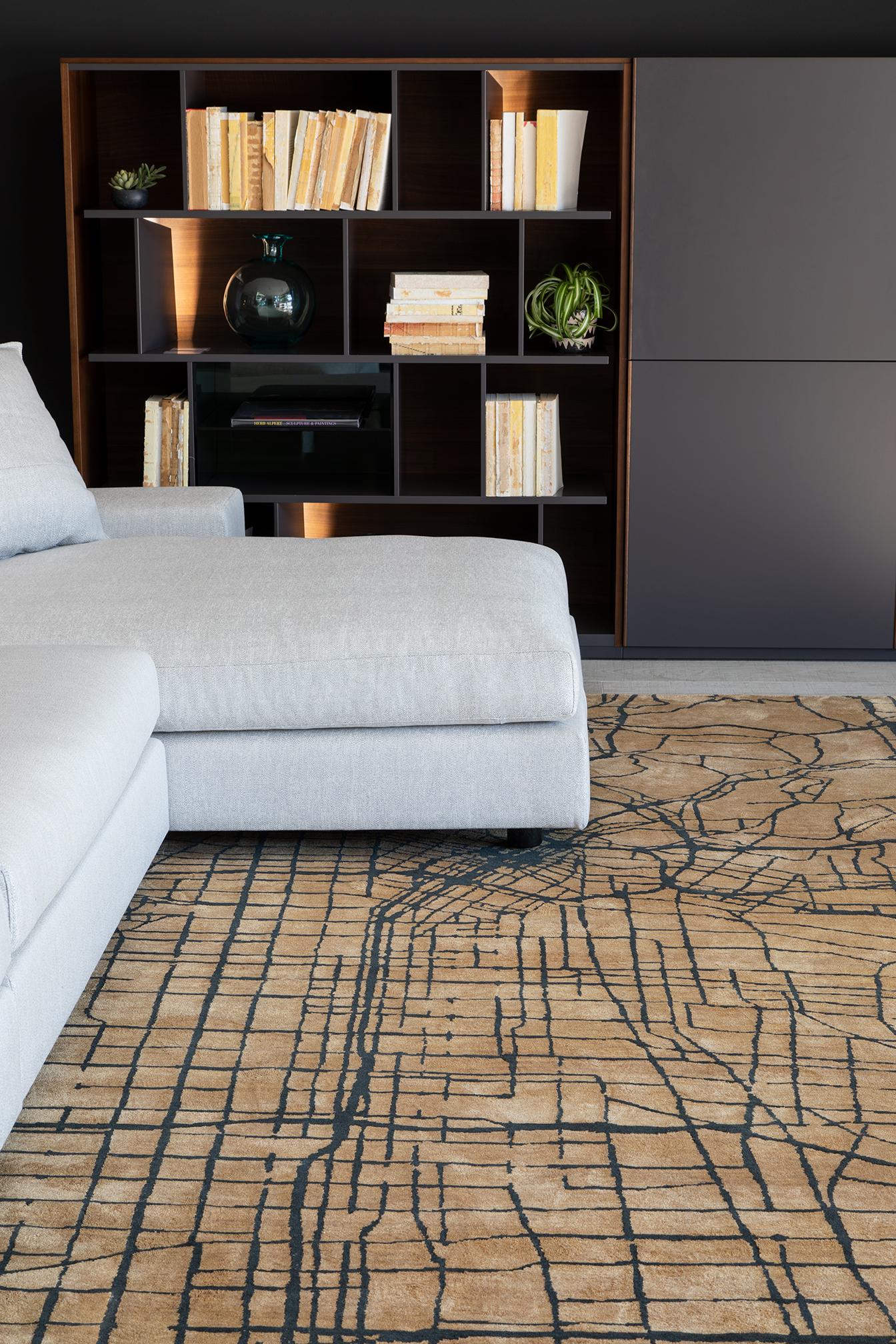 Mason is an homage to Erica's L.A. roots. The rug takes the bird's eye (or
private plane) view of the urban landscape into a wool field of gold traced with
black, cream traced with silver, with other colorways available including dark
charcoal