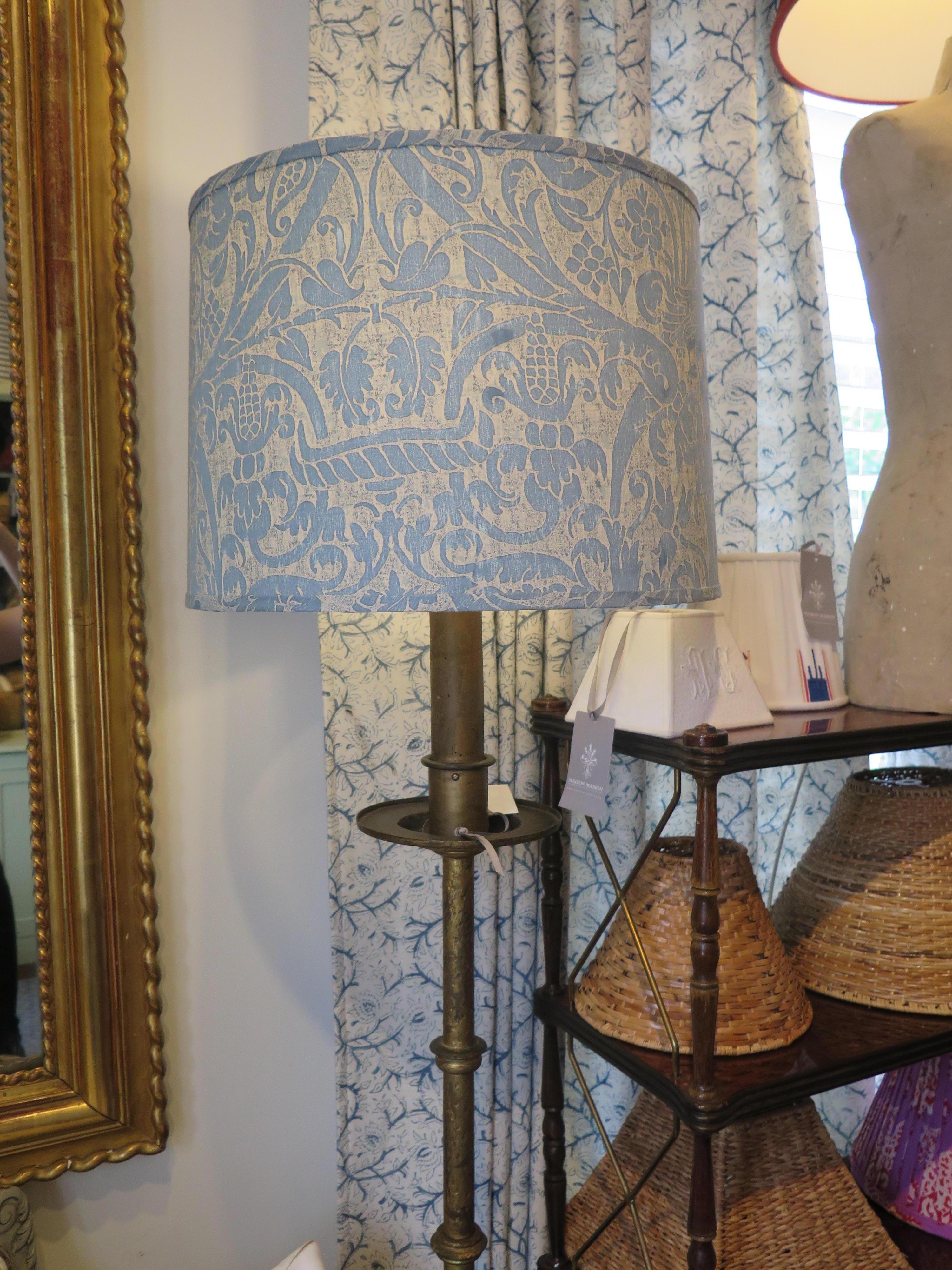 Beautiful Fortuny drum lampshades in a classic blue color and standard brass harp fitting. These are custom lampshades and can be reproduced or a different size can be made. Price listed is per lampshade. We currently have 2 in stock in the size