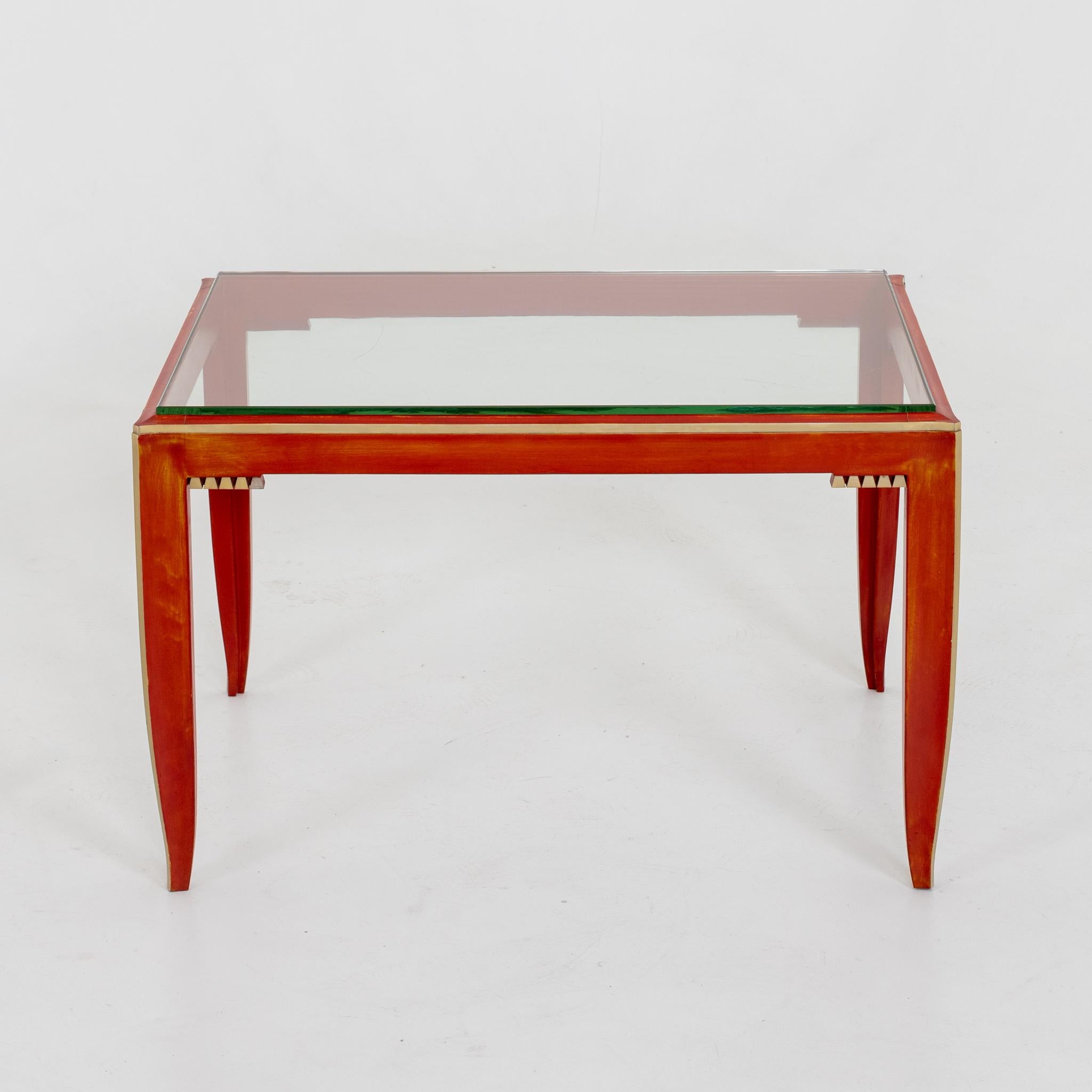Maison Franck Art Deco cocktail table. Red painted wood with original crystal glass top. Originally ordered in 1938 by Romi Goldmuntz ,owner of a important diamond company in Antwerp , Belgium. This suite of furniture along with a desk and cabinet