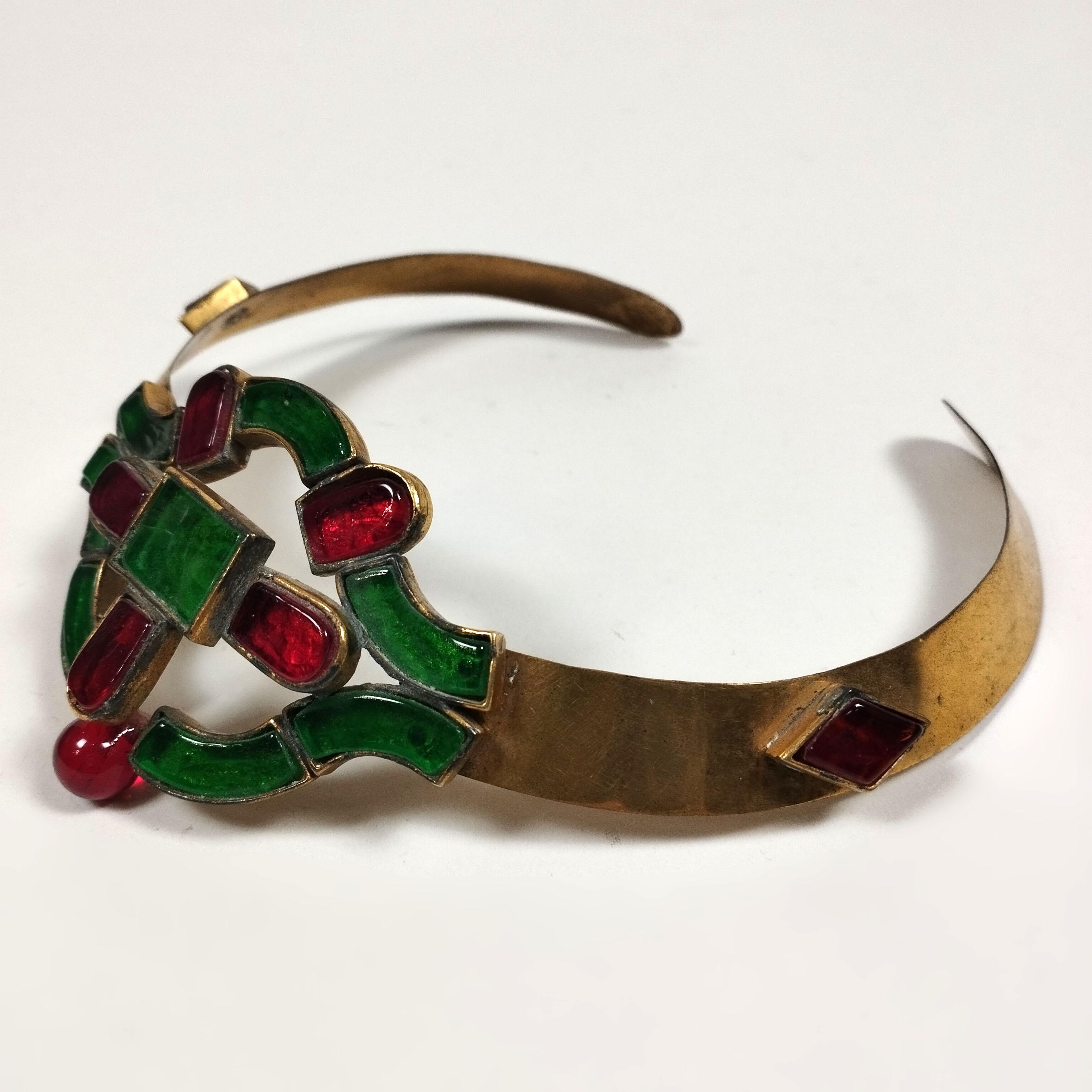 A 1990s French brass and painted glass choker by Chanel, manufactured by Maison Gripoix. The Art Decó design shows glasses in green and red. Sealed on the back.