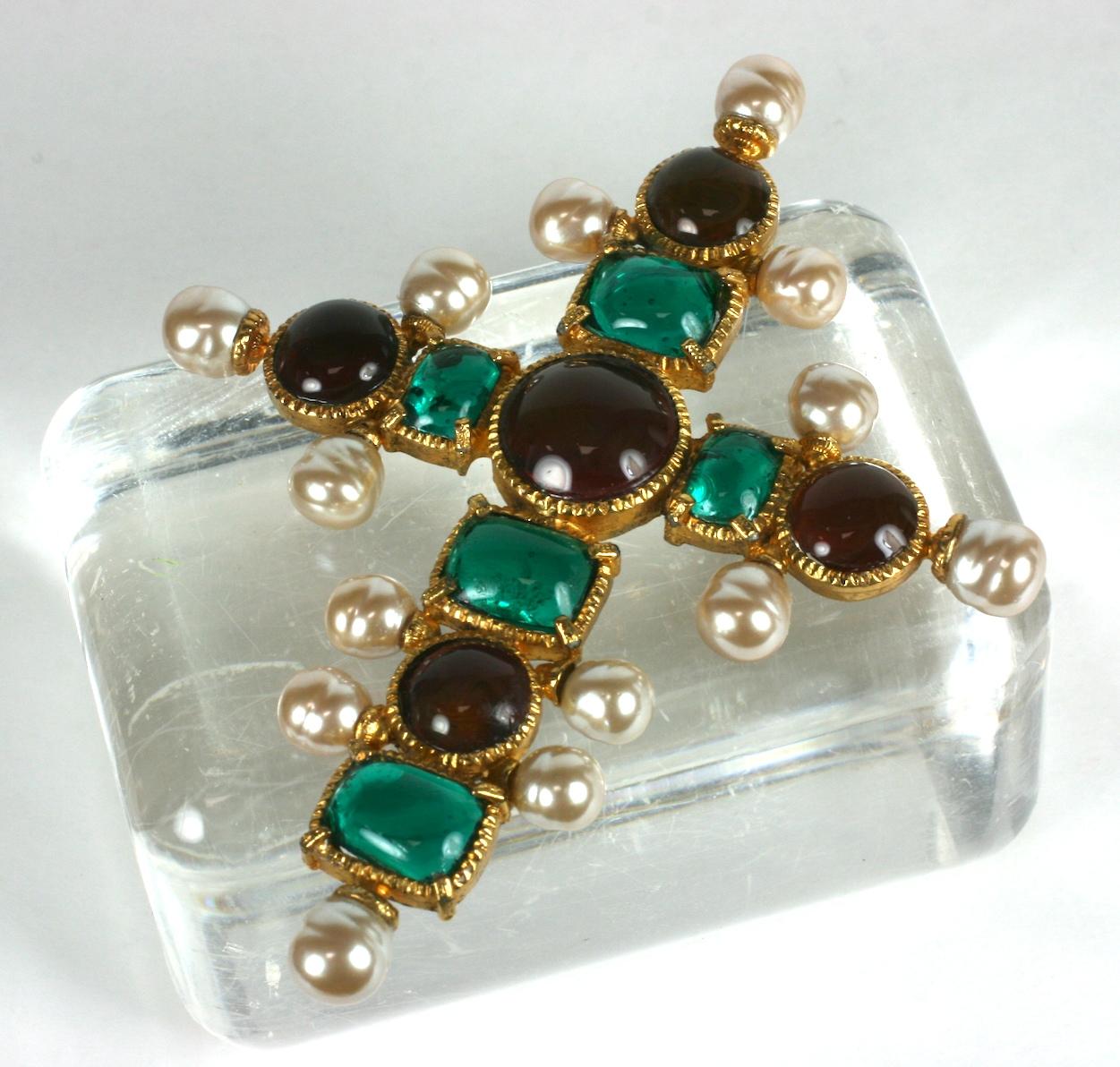 Maison Gripoix for Chanel Renaissance cross pendant brooch from 1992 Autumn/Winter. Of ruby and emerald poured glass enamel round and rectangular cabochons. Set in gilded bronze with handmade baroque nacre Maison Gripoix pearls.
Worn in a ruby color