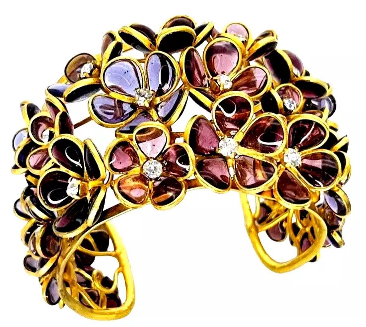 Simply Beautiful! Dimensional Gold tone Open Cuff Bracelet featuring Individual layered Flowers with shades of Purple Poured Glass Petals, studded with Crystals. Inner width measuring 2.25