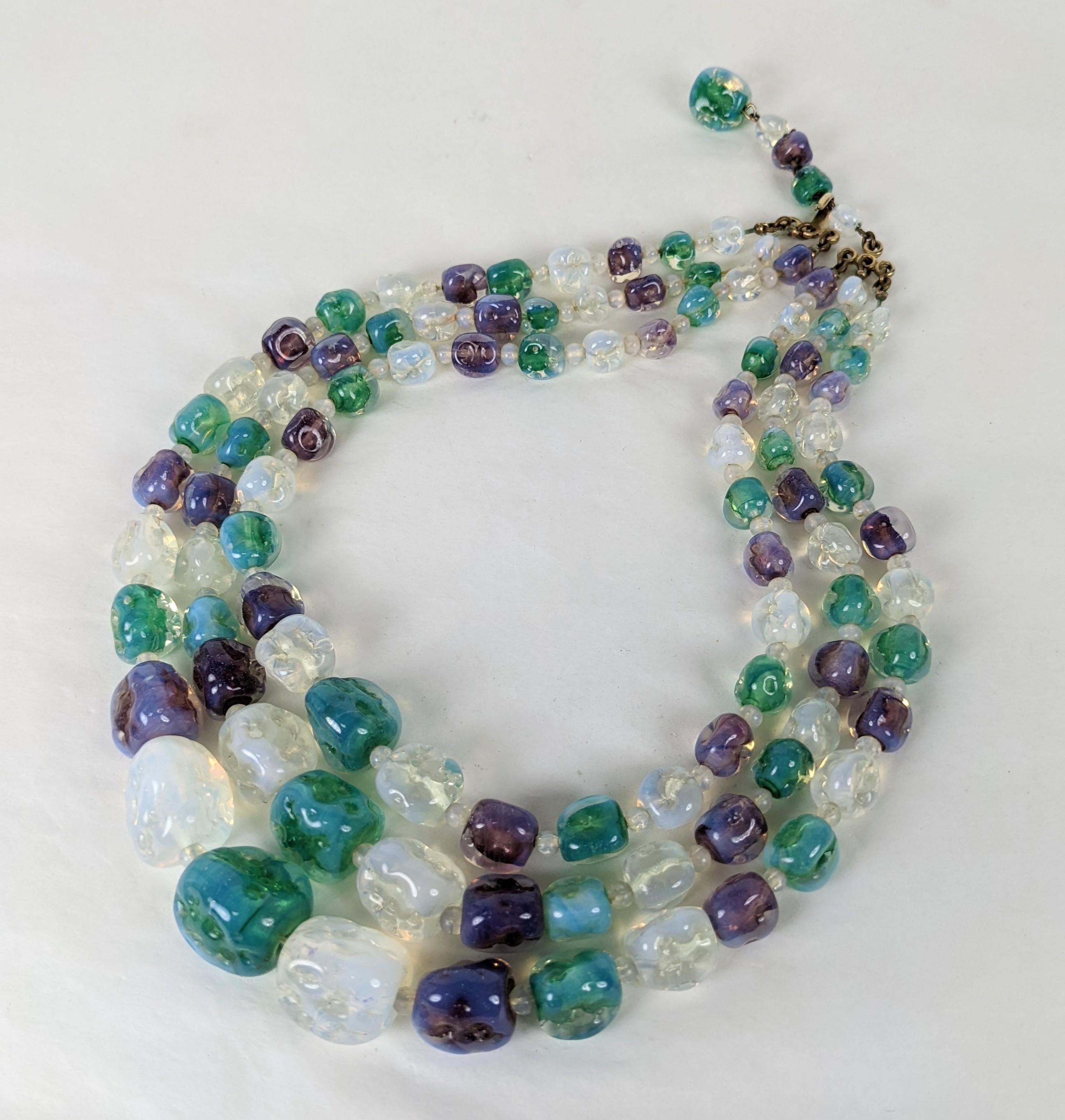 Striking Maison Gripoix Hand Made Pate de Verre Beads from the 1950's. Opaline glass is used for beads in opal, amythest and emerald all with opaline cast and a martele hammered finish. Each graduated bead is hand made and is spaced with smaller