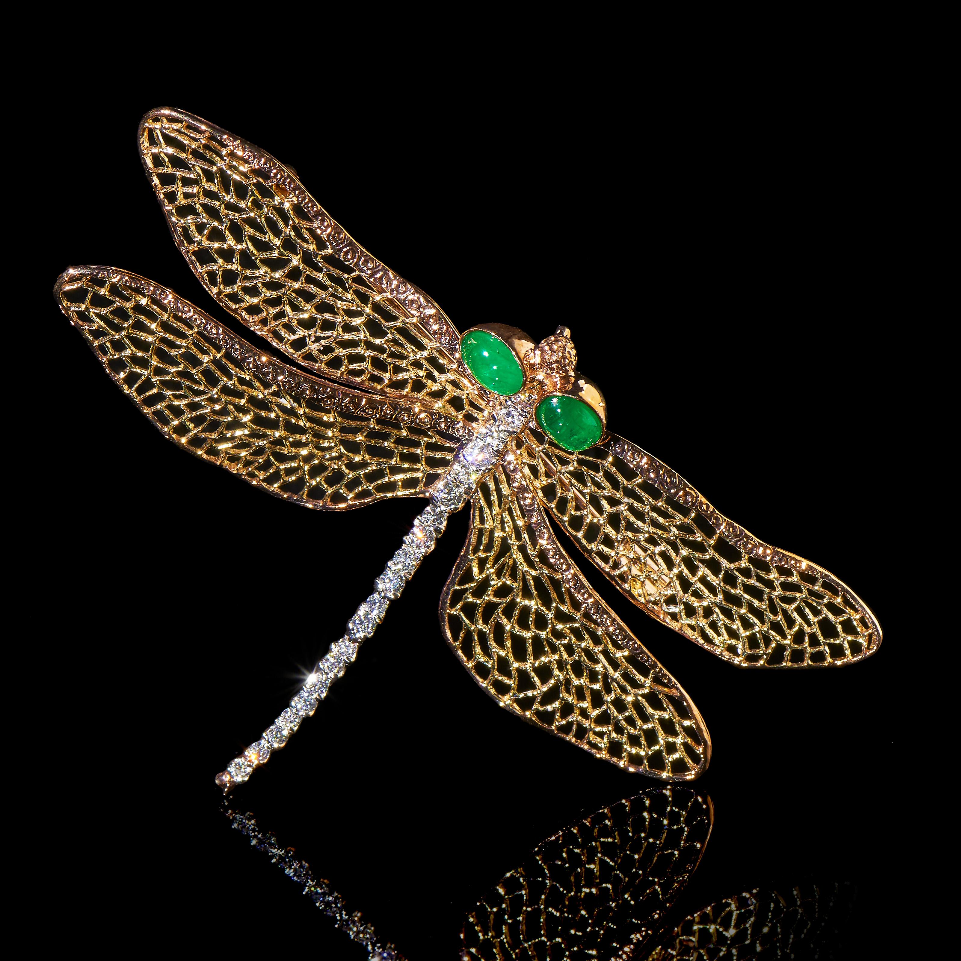 Light Wings

2 Emeralds (1.6cts), 20 Diamonds (0.815ct), 18K Yellow & White Gold. Length: 80mm

This dragonfly is realistically modeled. The veins of its wings are intricately carved in filigree style to show the lightness and transparency of its