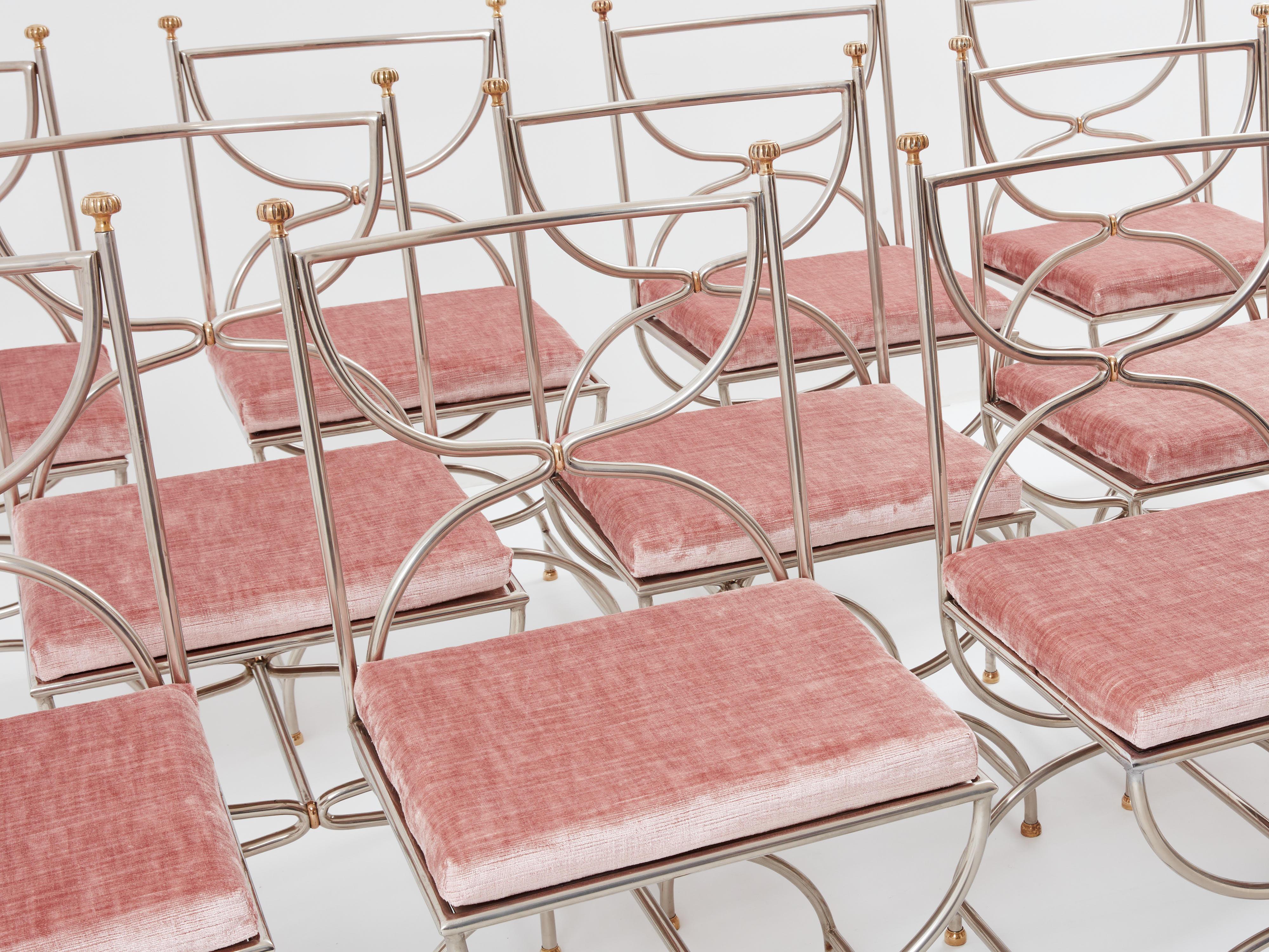 Beautiful set of 1960’s Curule Savonarola chairs made of heavy stainless steel metal with brass accents. This rare set of twelve chairs is a perfect example of Maison Jansen neoclassicism from the 1960s and 1970s. The sparse original structure feels