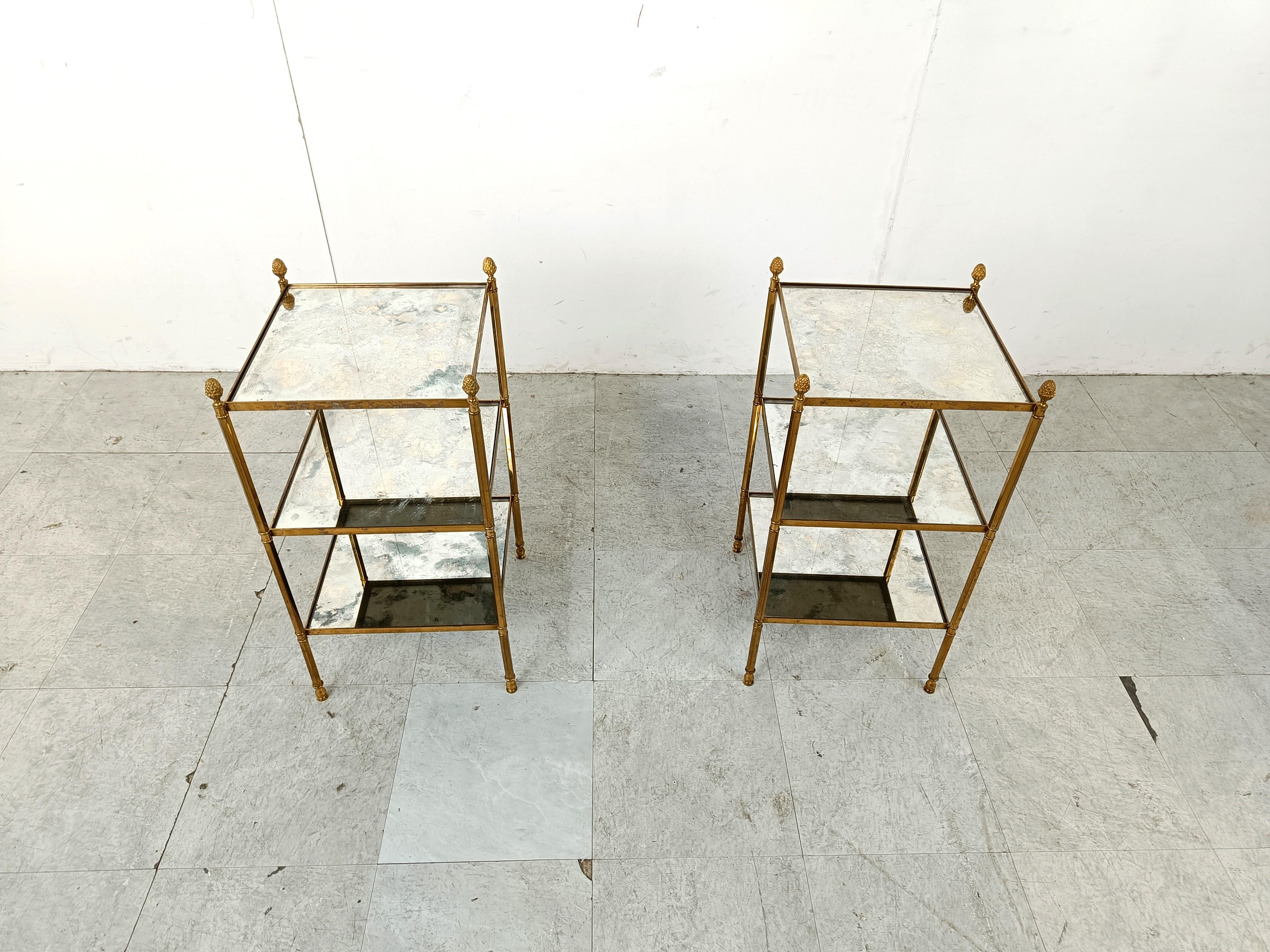 Mid century gilt metal acorn side tables by Maison Jansen. 

Very nicely patinated gilt metal frames with mirrored glass tops.

Very detailed acorn finials

1960s - France

Dimensions:
Height: 65cm/25.59