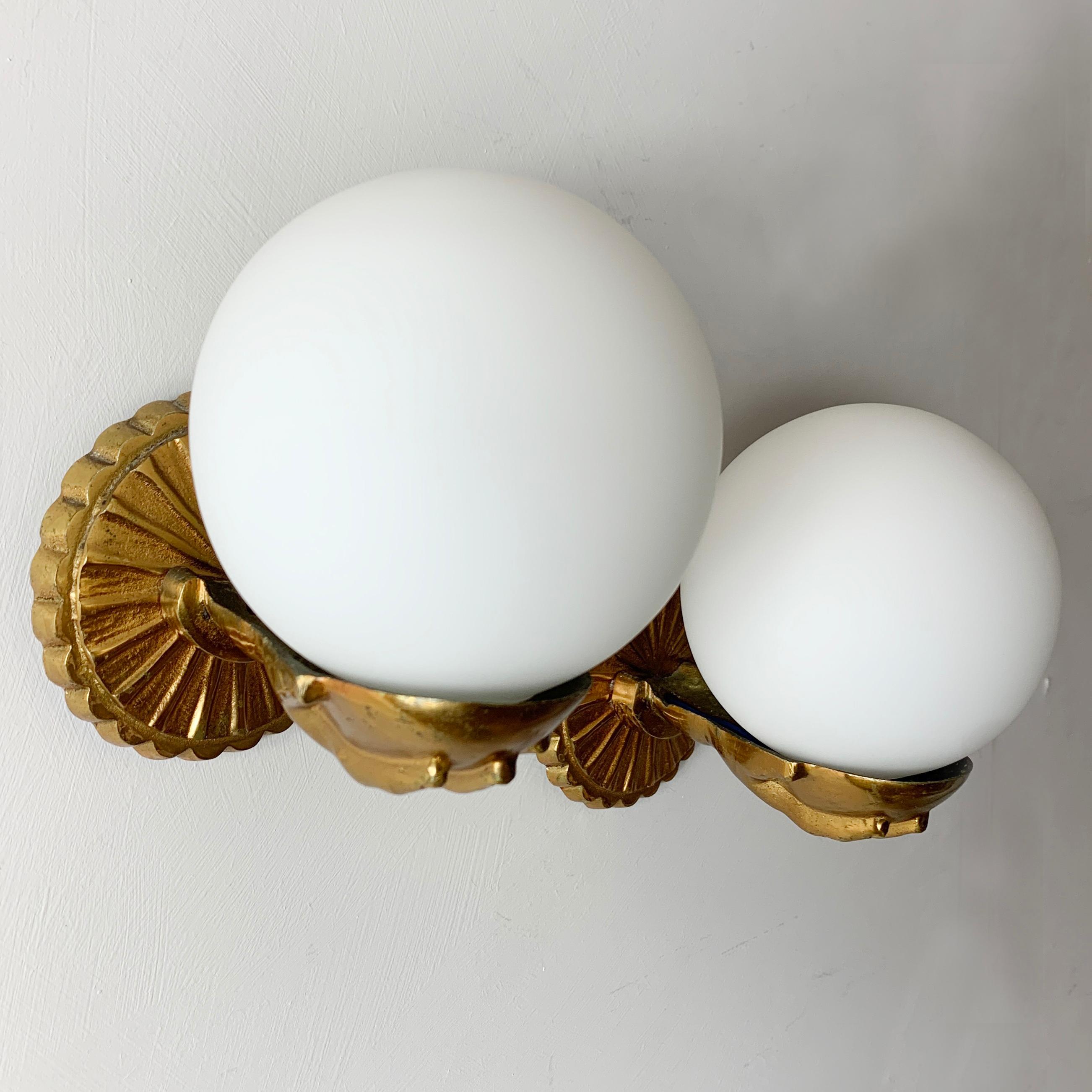 Maison Jansen Attributed, Brass Hand and Globe Wall Lights In Good Condition In Hastings, GB