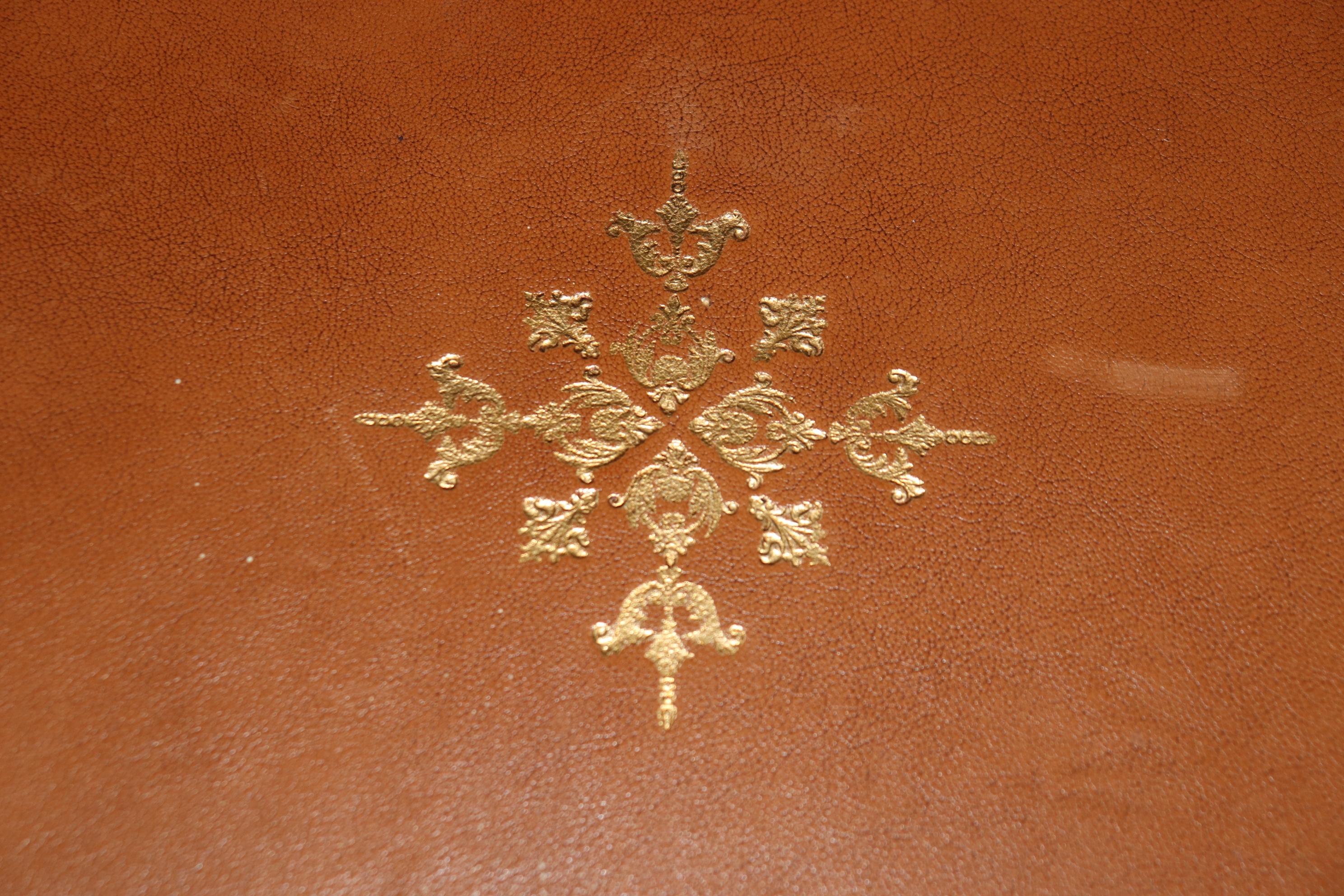 This is a spectacular Maison Jansen Attributed games table with bronze mounts and brass details and a superb gold tooled embossed leather top. The table is strongly attributed to Maison Jansen of Paris and is in good condition with minor signs of