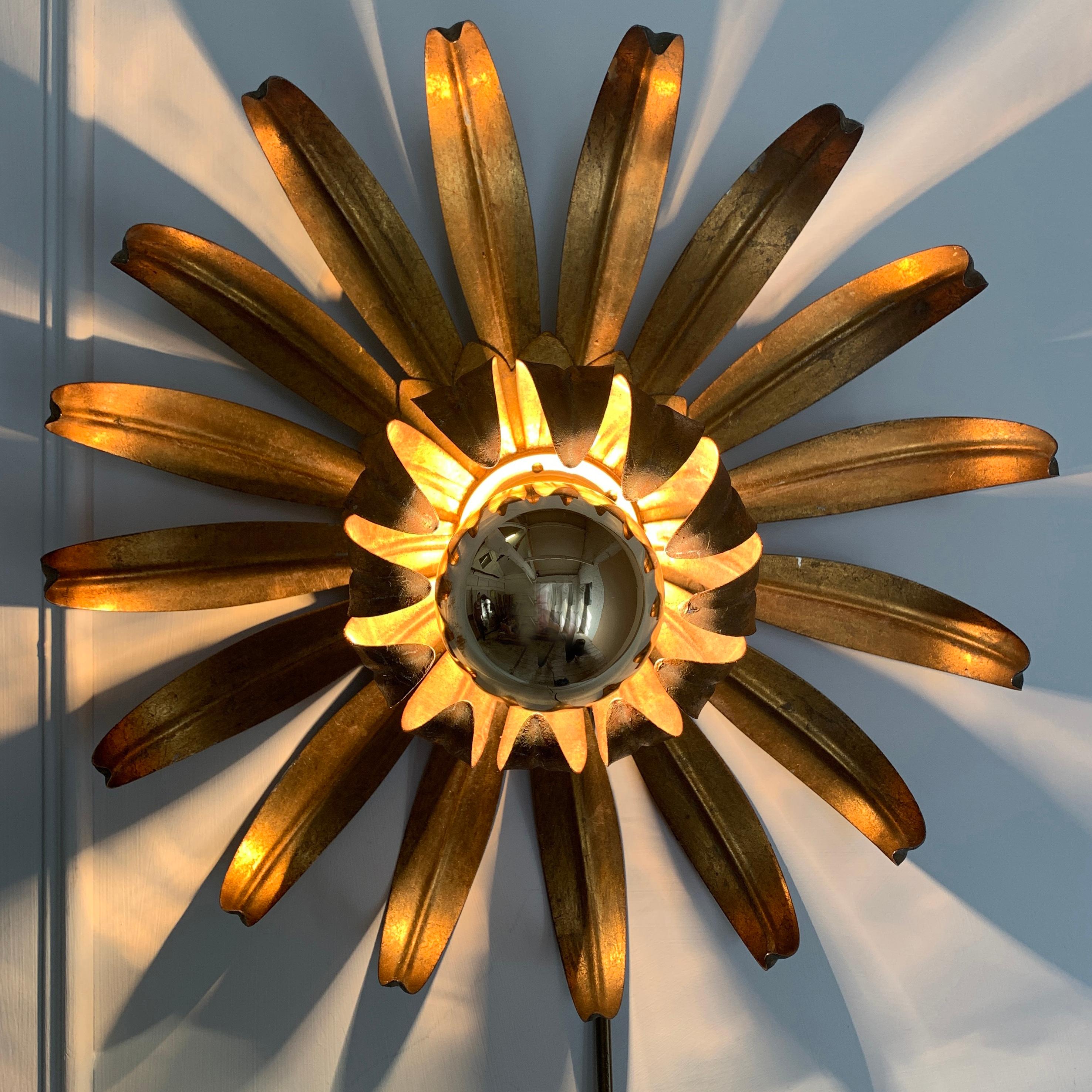 Gilt metal flower shaped ceiling light
Flower flush light attributed to Maison Jansen,
circa 1970s
The light has a hook on the back to attach to the ceiling
The light is 34cm width, 12cm depth
We have 2 of these available, priced individually