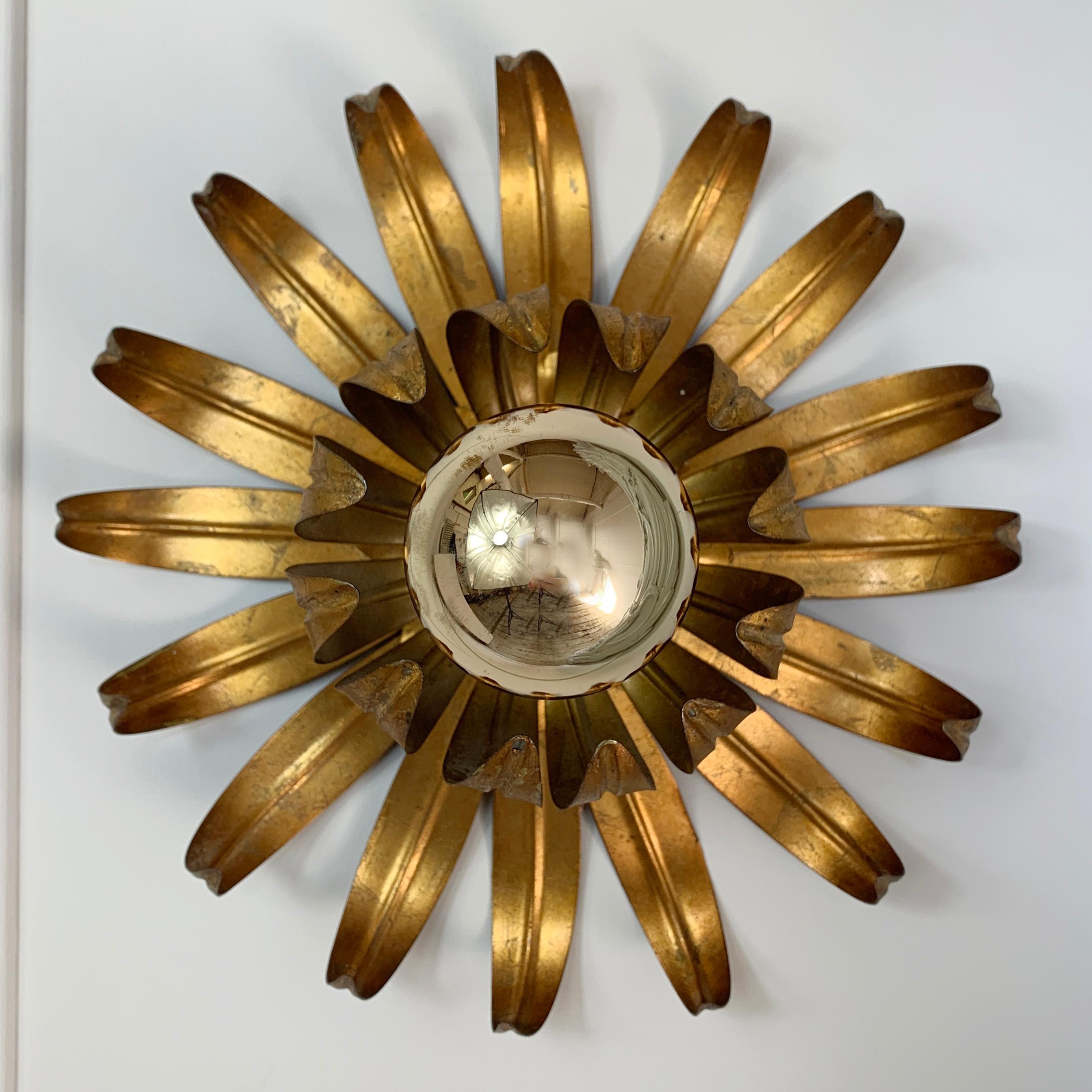 Gilt metal flower shaped ceiling light
Flower flush light attributed to Maison Jansen,
circa 1970s
The light has a hook on the back to attach to the ceiling
The light is 29cm width, 12cm depth
We have 2 of these available, priced individually