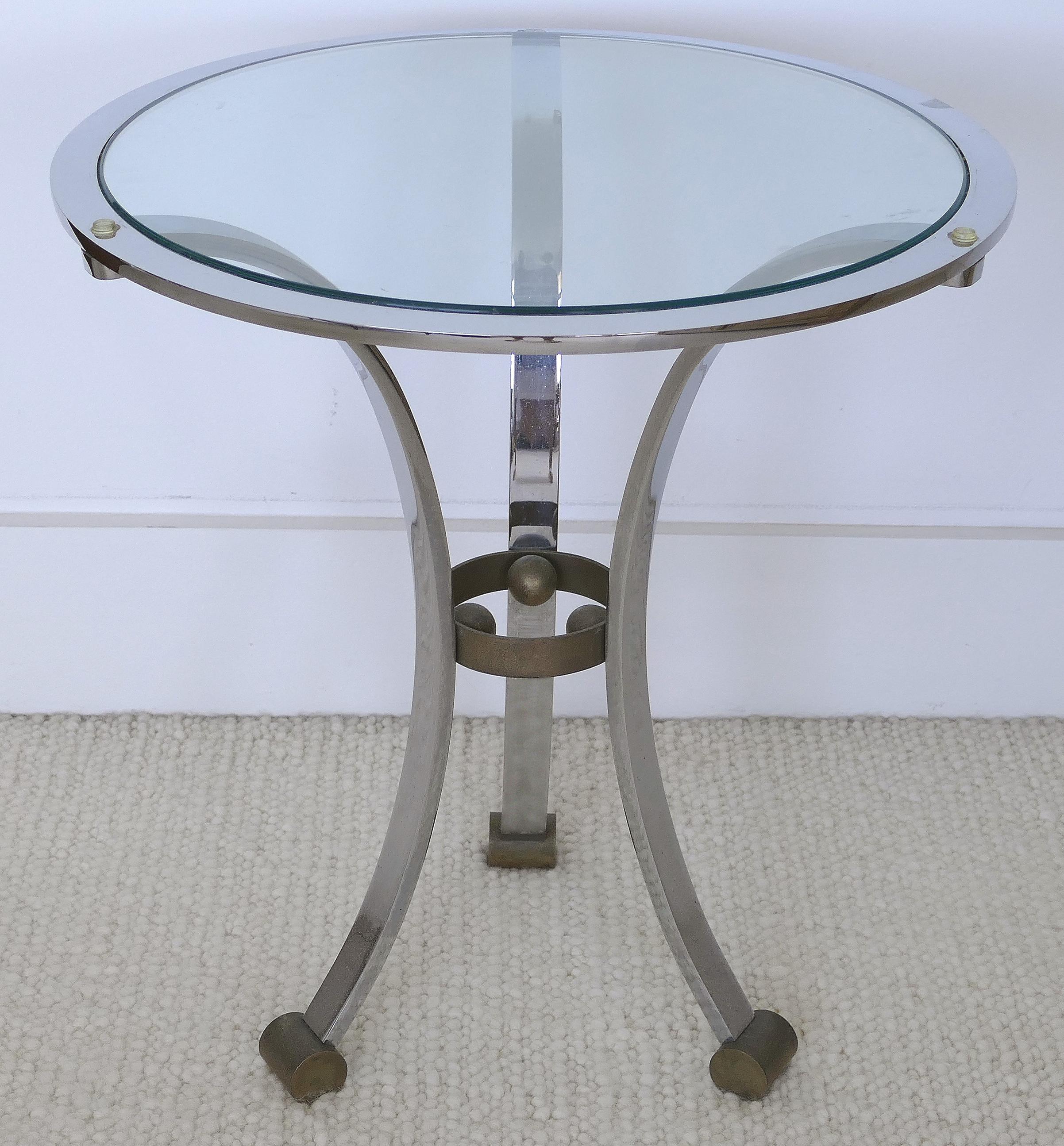 Maison Jansen attributed Gueridon table in stainless steel and bronze

Offered for sale is a fine and elegant gueridon side table of stainless steel and bronze attributed to Maison Jansen. The table has an inset glass top.