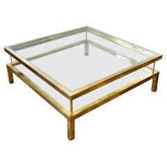 Maison Jansen Atribuida Gran mesa de centro con tapa corredera Vitrine de latón de mediados de siglo