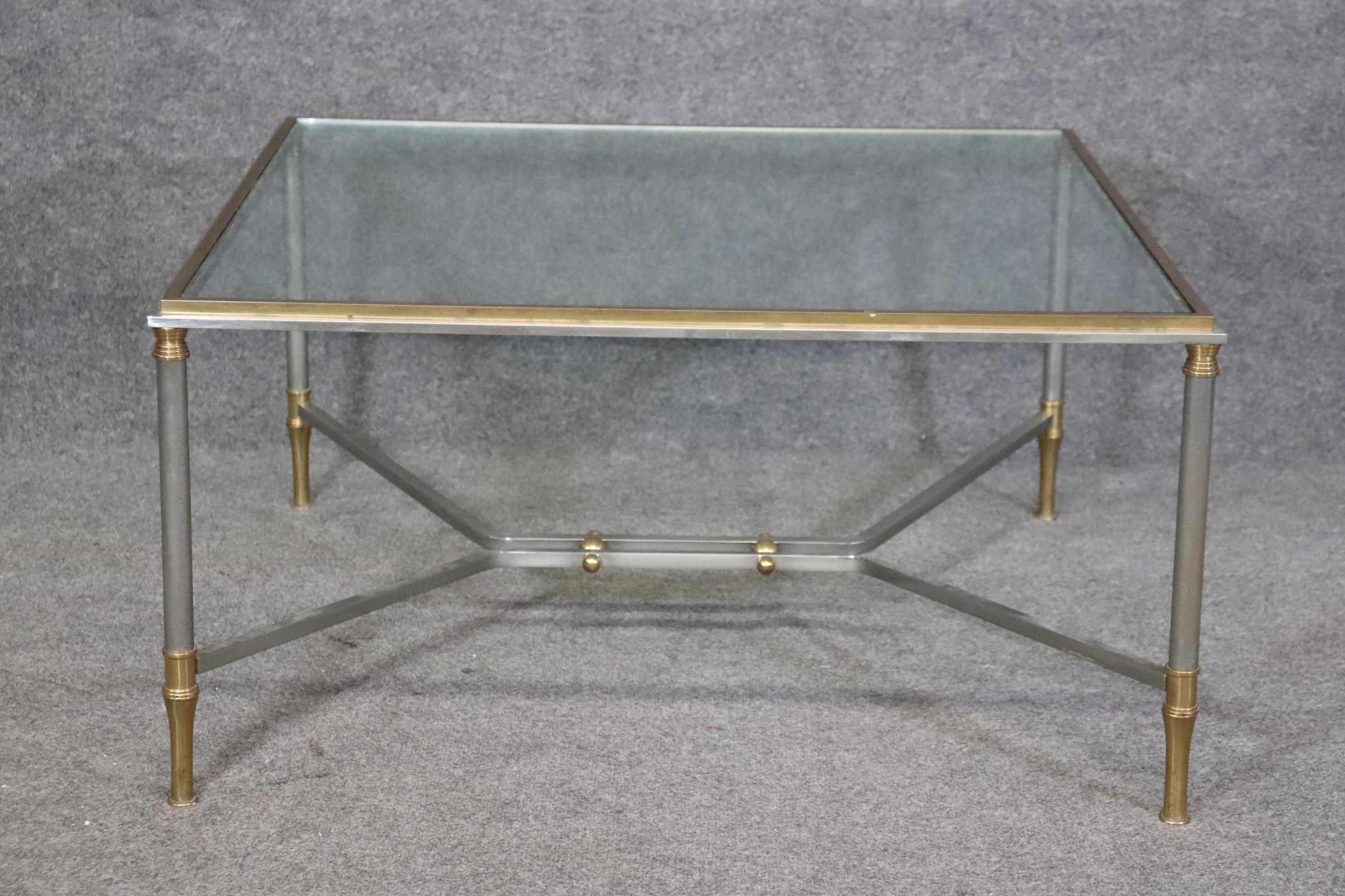 Dimensions: Height: 18 1/4 in Width: 36 in Depth: 36 1/4 in 


This Maison Jansen French Directoire style glass top coffee table is of the highest quality! Maison Jansen made some of the world's most chic furniture and designed to replicate the