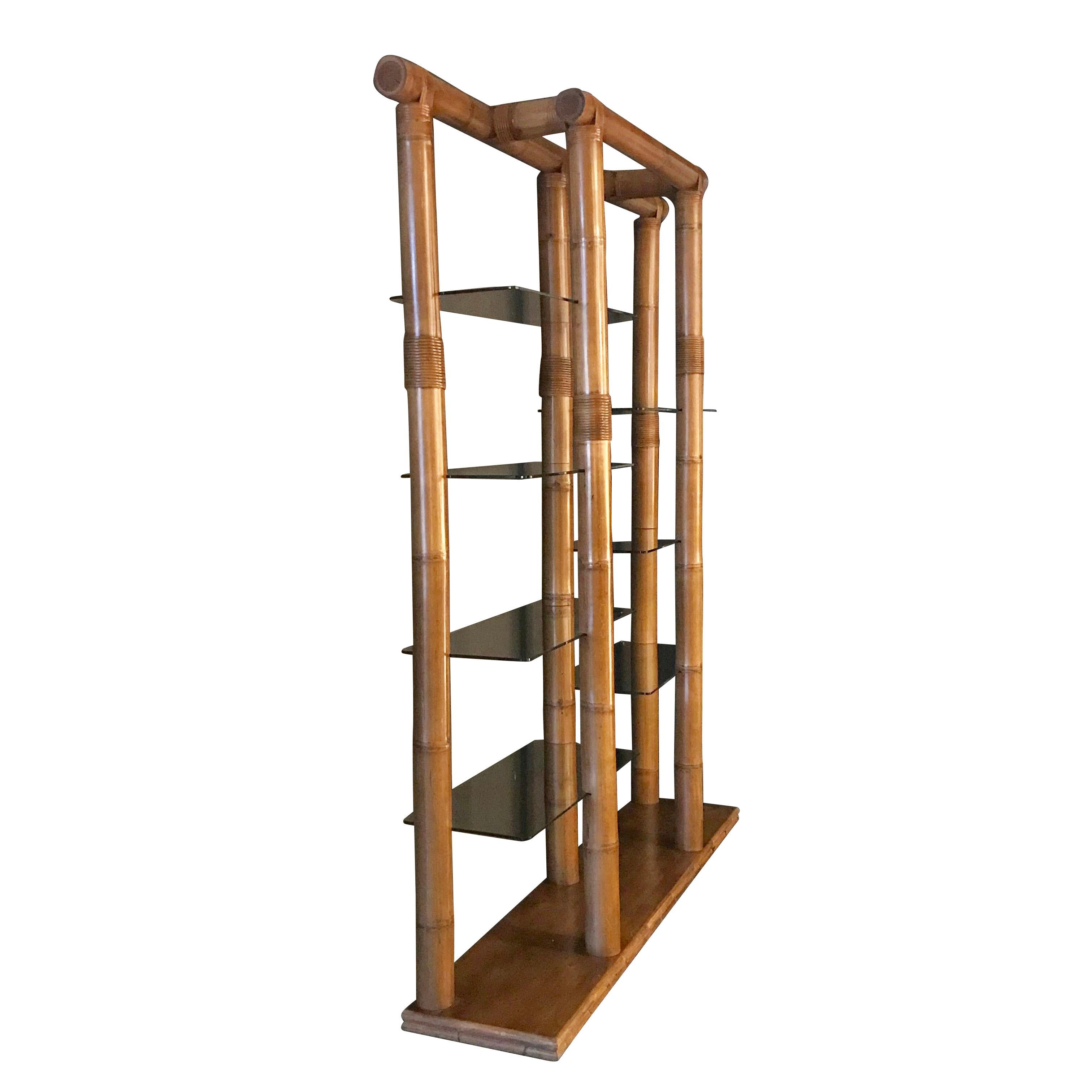 1960s French very unusual Maison Jansen bamboo and glass shelved étagère.
Seven glass shelves measuring 15