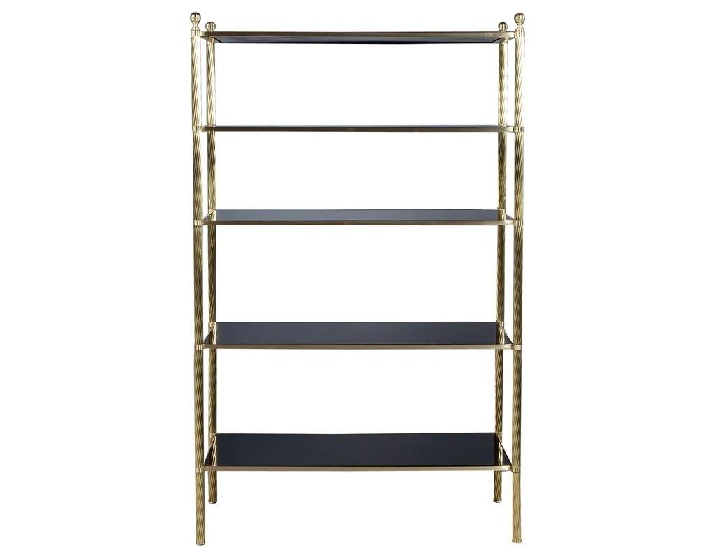 Original vintage etagere, exquisite brass frame with smoke glass shelves.