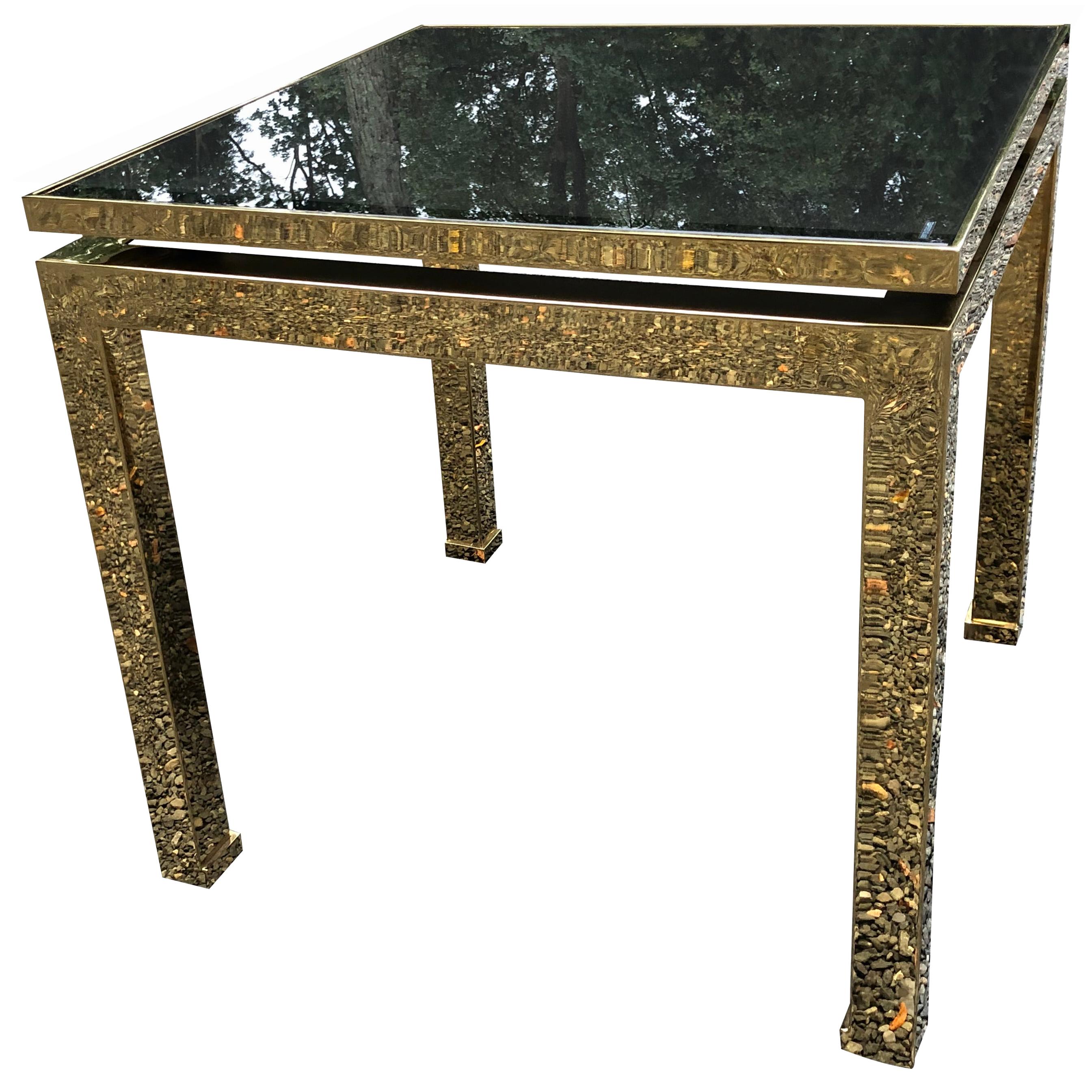Sophisticated midcentury Guy Lefevre for Maison Jansen side table in brass and smoked dark glass. Elegant turned in feet; very easy, thick brass construction, France, 1970s, very good condition; there are some minor scratches in glass but only