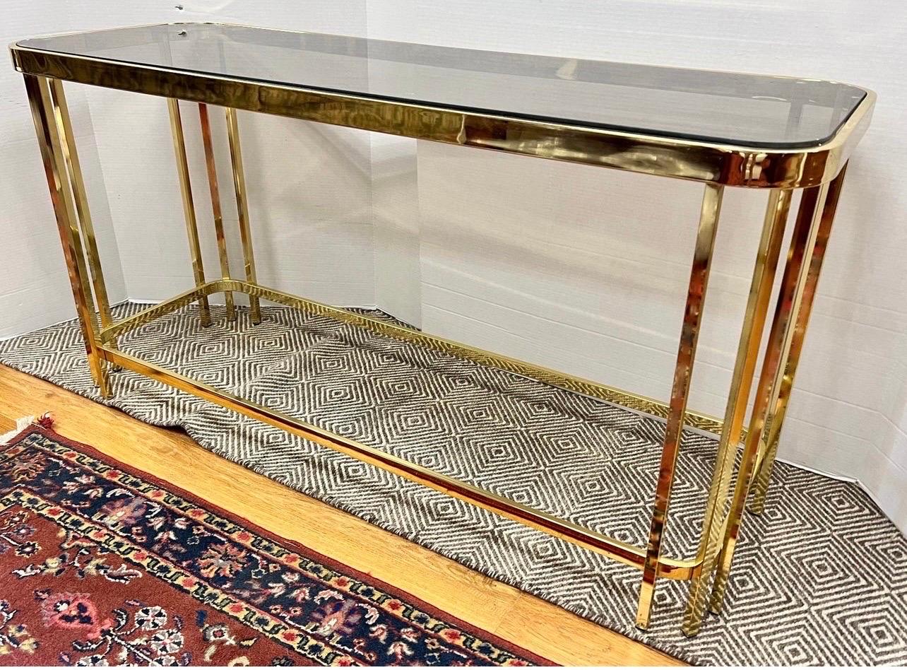 Rare and coveted Maison Jansen brass and glass console table with glass inset at top. Gorgeous lines and better scale. Why not own the best?