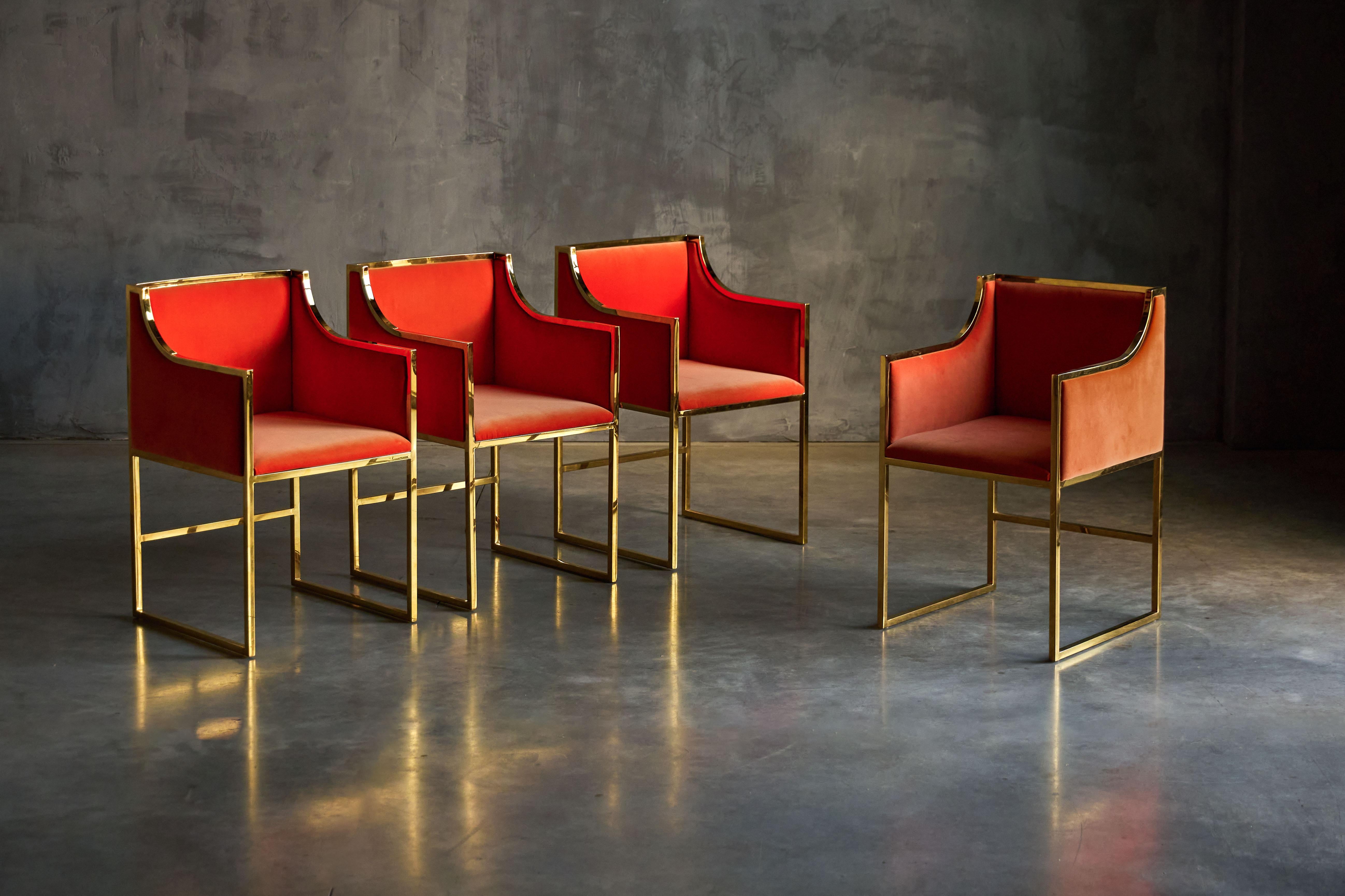 Exquisite orange velvet dining chairs, reminiscent of the iconic Maison Jansen style from 1980s France. This stunning set of chairs, in impeccable condition, exudes timeless elegance and opulence. Their vibrant orange velvet upholstery adds a bold
