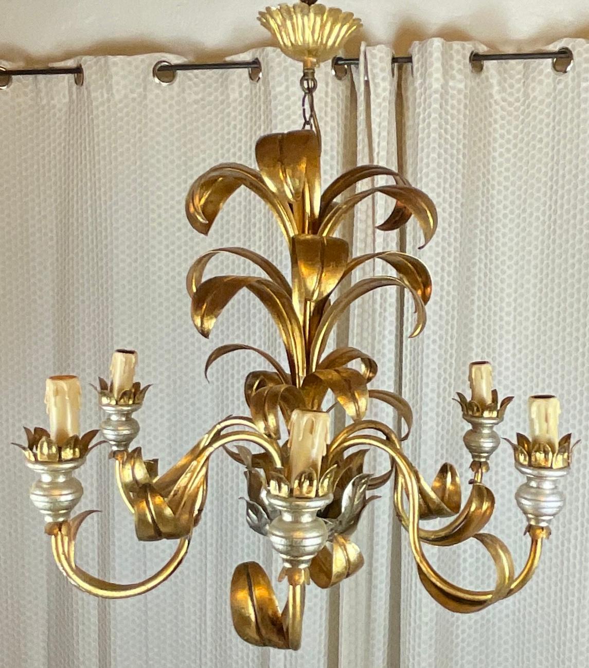 A stunning French six-arm light or chandelier by Maison Jansen, in the style of Bagues gilt brass and metal. 

Very good quality piece. This fixture with lovely silver and gold leaf finishing accents takes six E14 standard screw bulbs to illuminate.