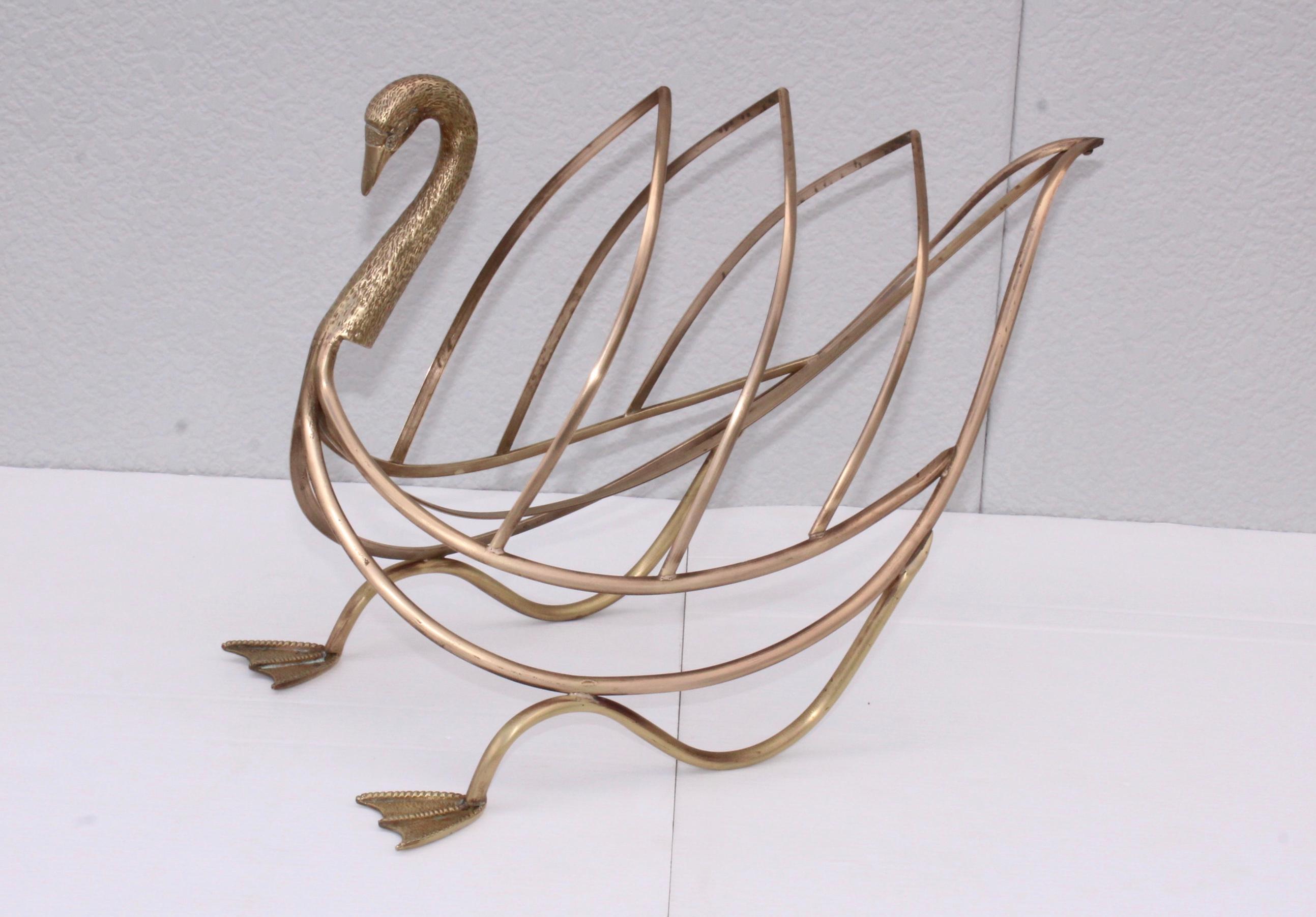 1960s solid brass swan magazine holder by Maison Jansen, in vintage condition lightly hand polished.