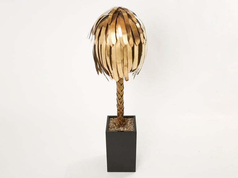 This beautiful palm tree floor lamp is one of the most iconic pieces by French design firm Maison Jansen. It’s made largely from bright brass, which gives it an air of high-end glamour. But what makes the Jansen palm tree pieces most extraordinary