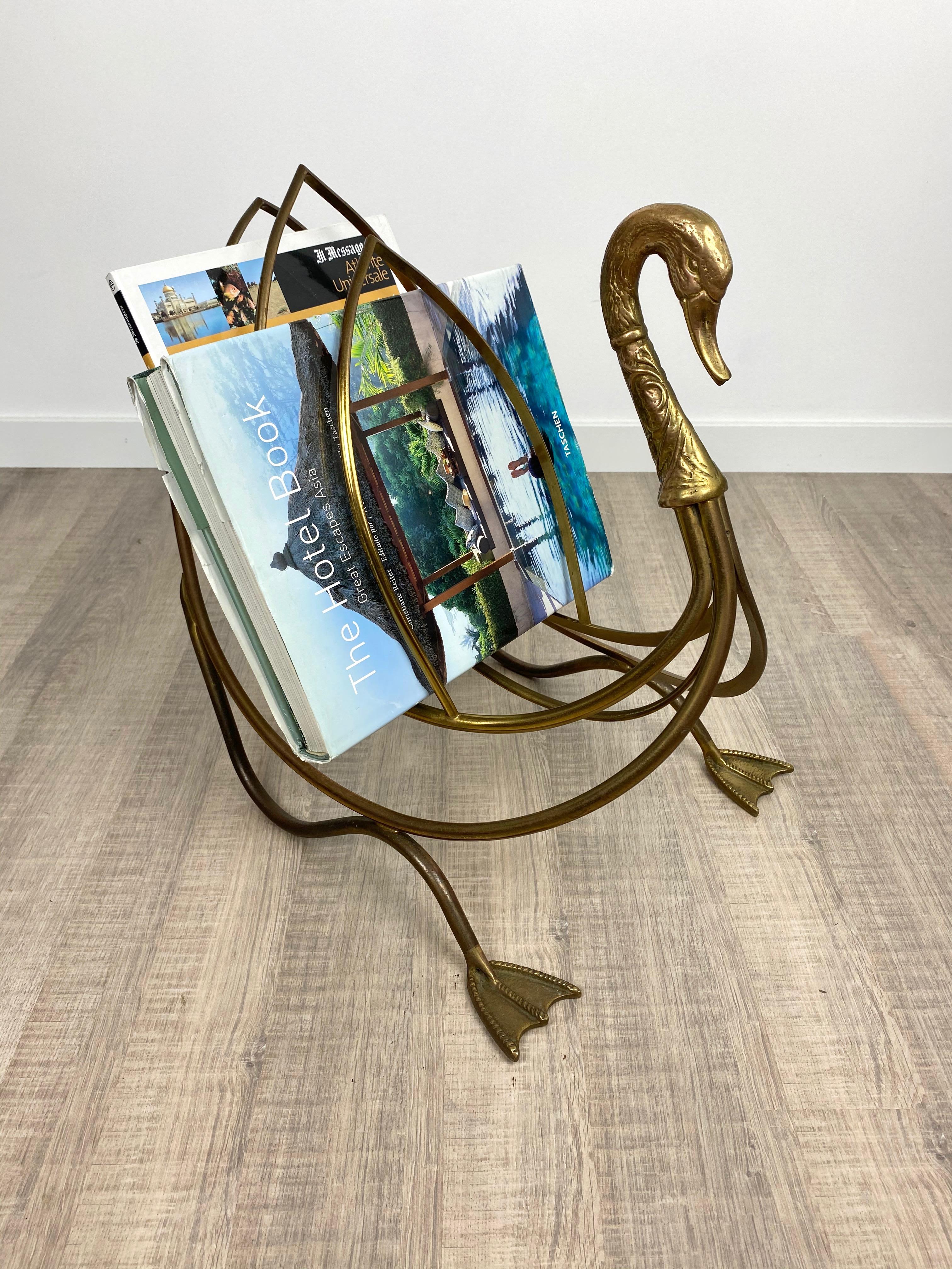 Solid brass swan magazine holder made by the French Maison Jansen. The piece features detailed swan head and feet and copious space for magazines and newspapers. Made in France in the 1960s, the piece is in great vintage condition with
