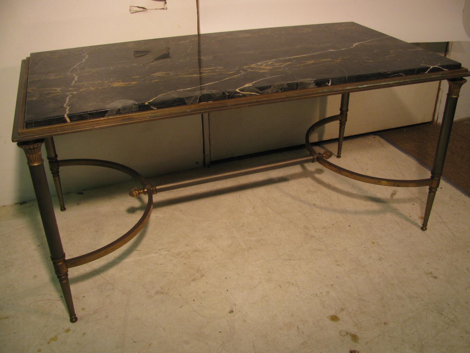 Simple and elegant Portoro marble-top cocktail table very much in the manner of Maison Jansen. Top quality in all phases. Diminutive in size 37 x 19.25 great for a smaller space. Metals have collected their patina over time, very evenly. Marble is