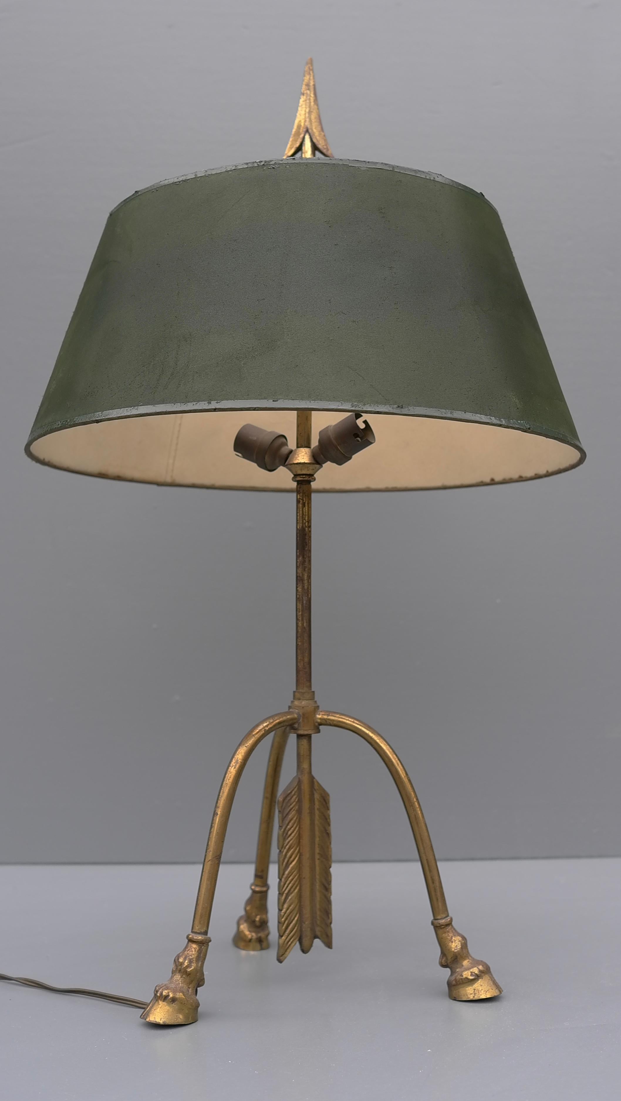 Maison Jansen 'Centaur' Hooves and Arrow Brass table lamp, France 1940's.

The hood can position in different heights.