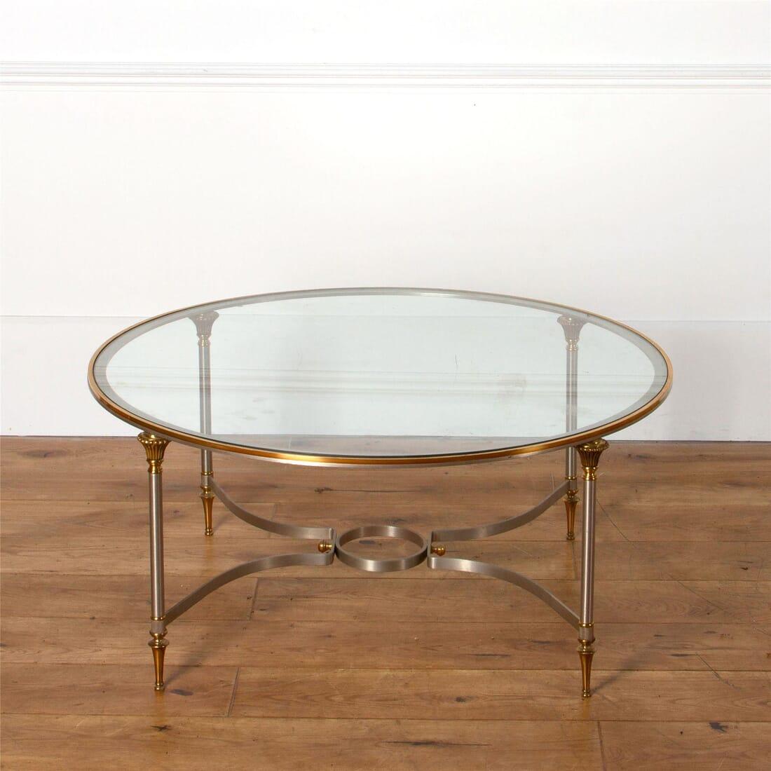 A French 1970s Maison Jansen Paris circular coffee table in steel and brass.